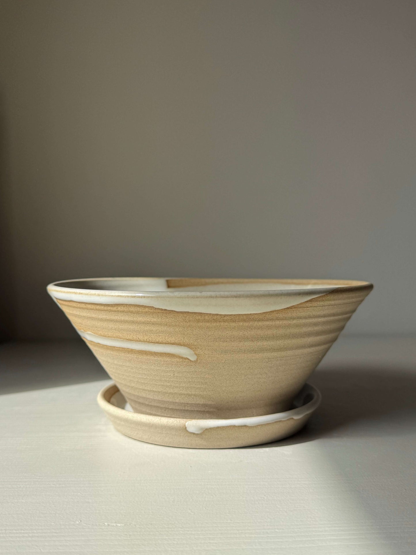 Handmade ceramic Berry Bowl - Yuki Series with drip plate, featuring soft white glaze over toffee clay for easy fruit rinsing.