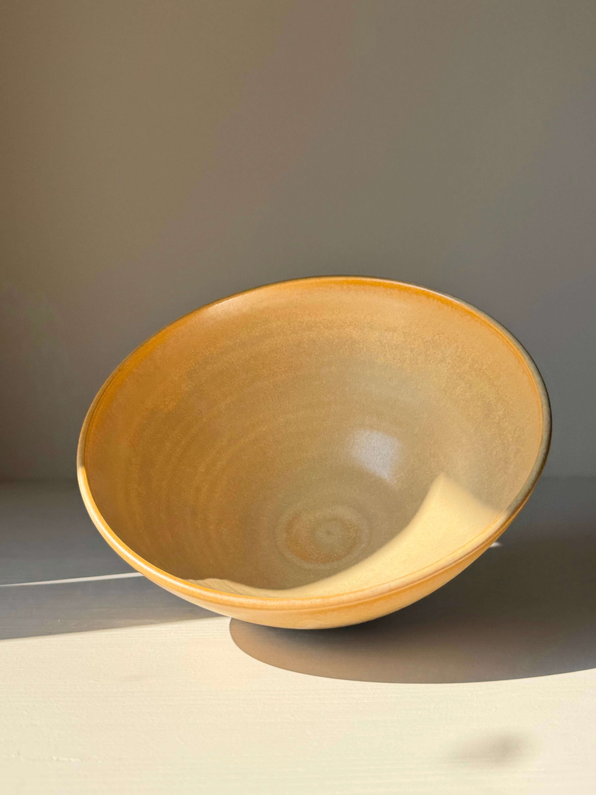 Handmade ceramic Bowl - Golden Yellow #01 with satin glaze, medium-sized with gently sloping sides, perfect for everyday use or table display.