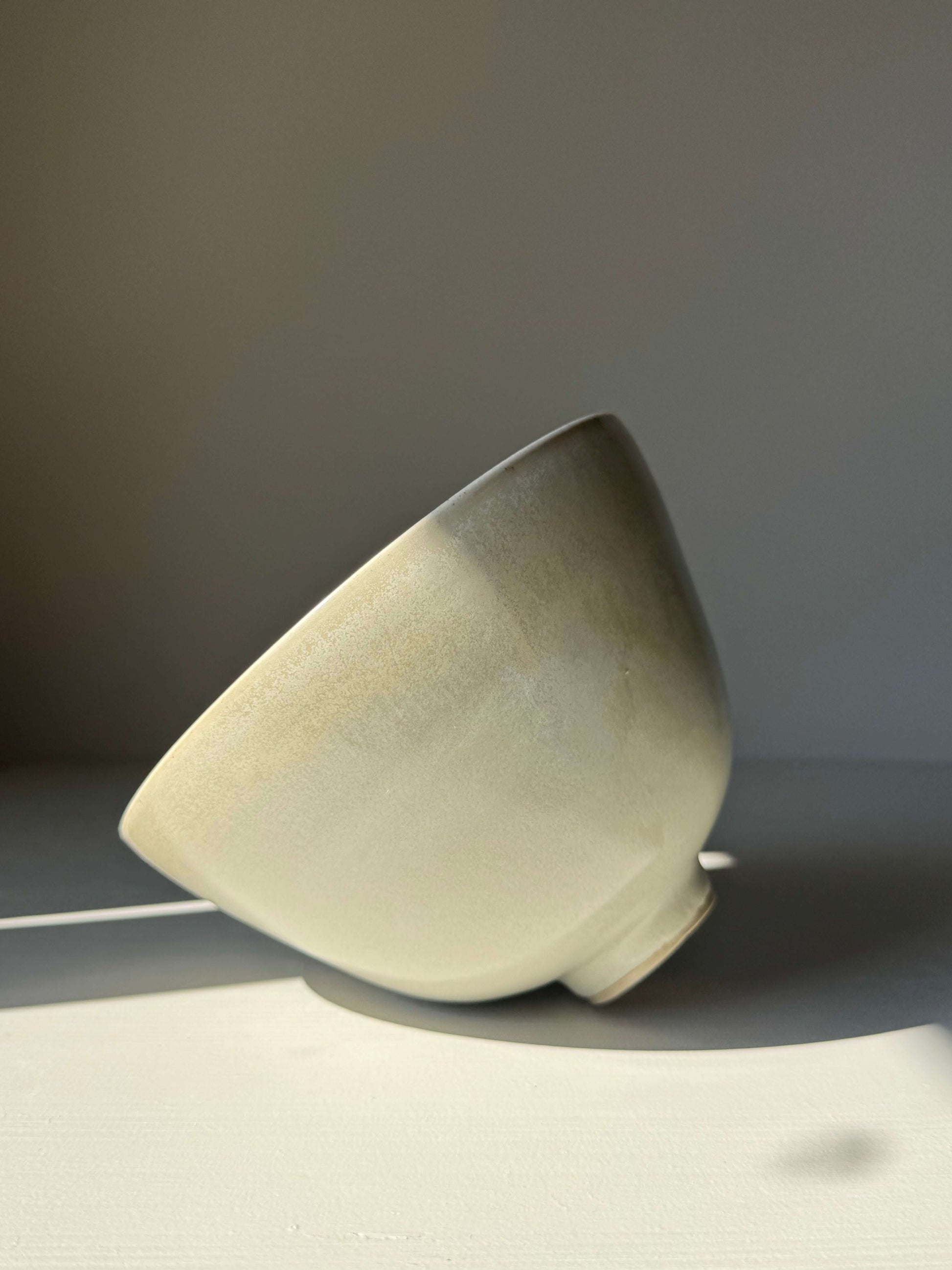 Bowl - Moonstone #01, handmade ceramic bowl with moonstone glaze, showcasing tall rounded form and raised foot, subtle light variations.