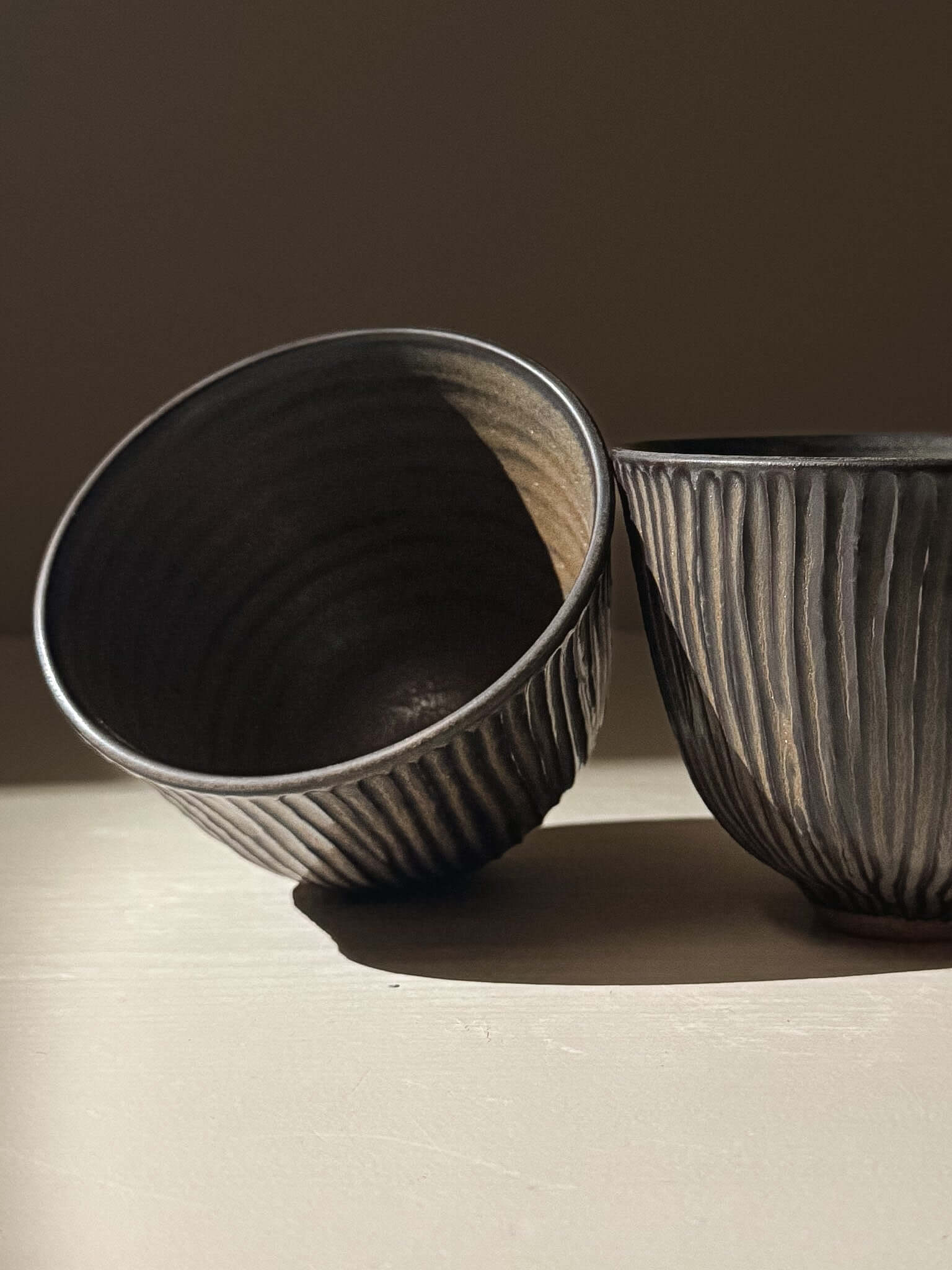 Carved Yunomi Cup - Black Truffle, handmade ceramics with textured pottery design, showcasing unique wheel-thrown craftsmanship.
