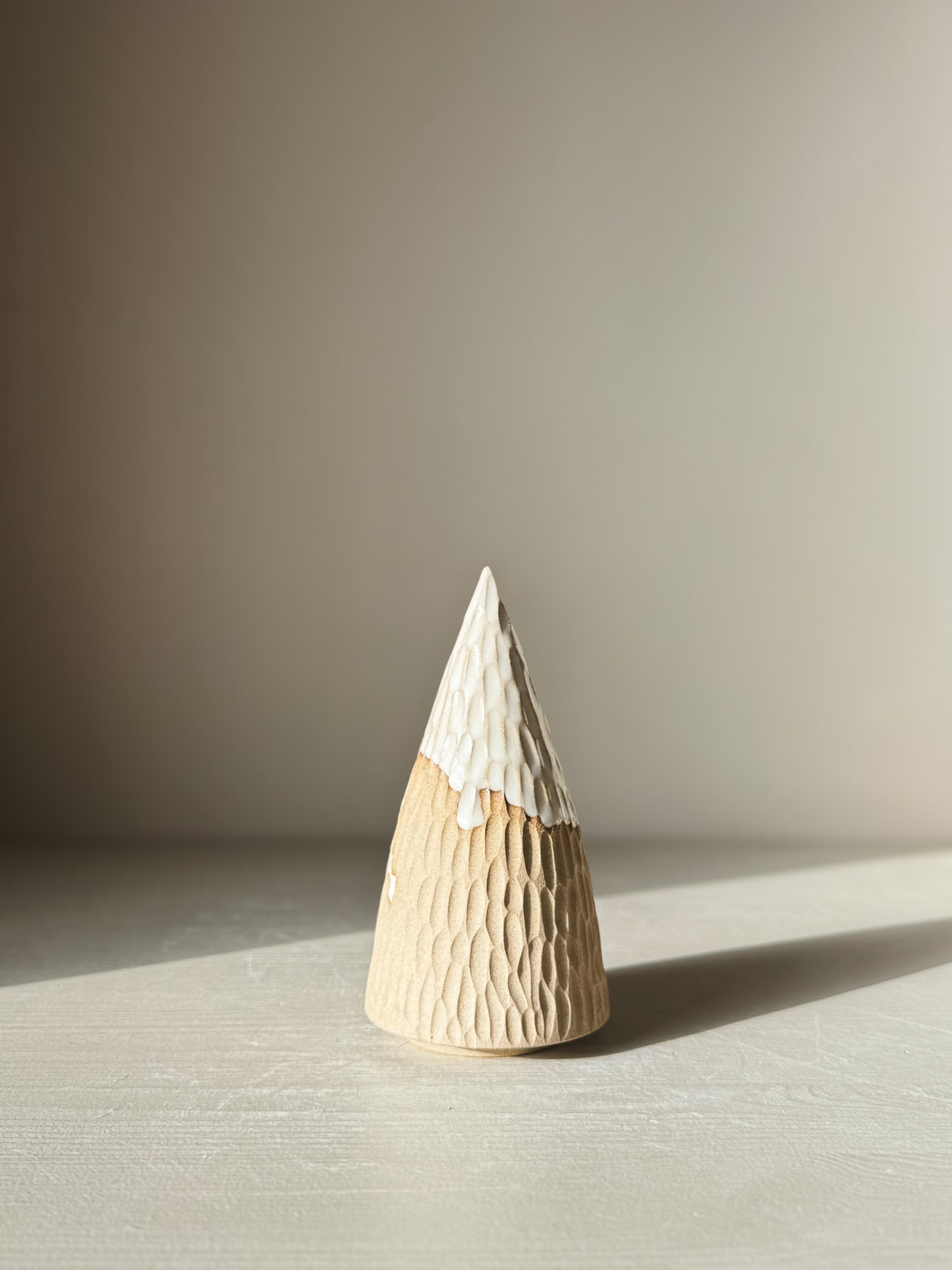 Carved Ceramic Tree – Yuki #02 with glossy white glaze on a textured surface, showcasing the craftsmanship and minimal design.