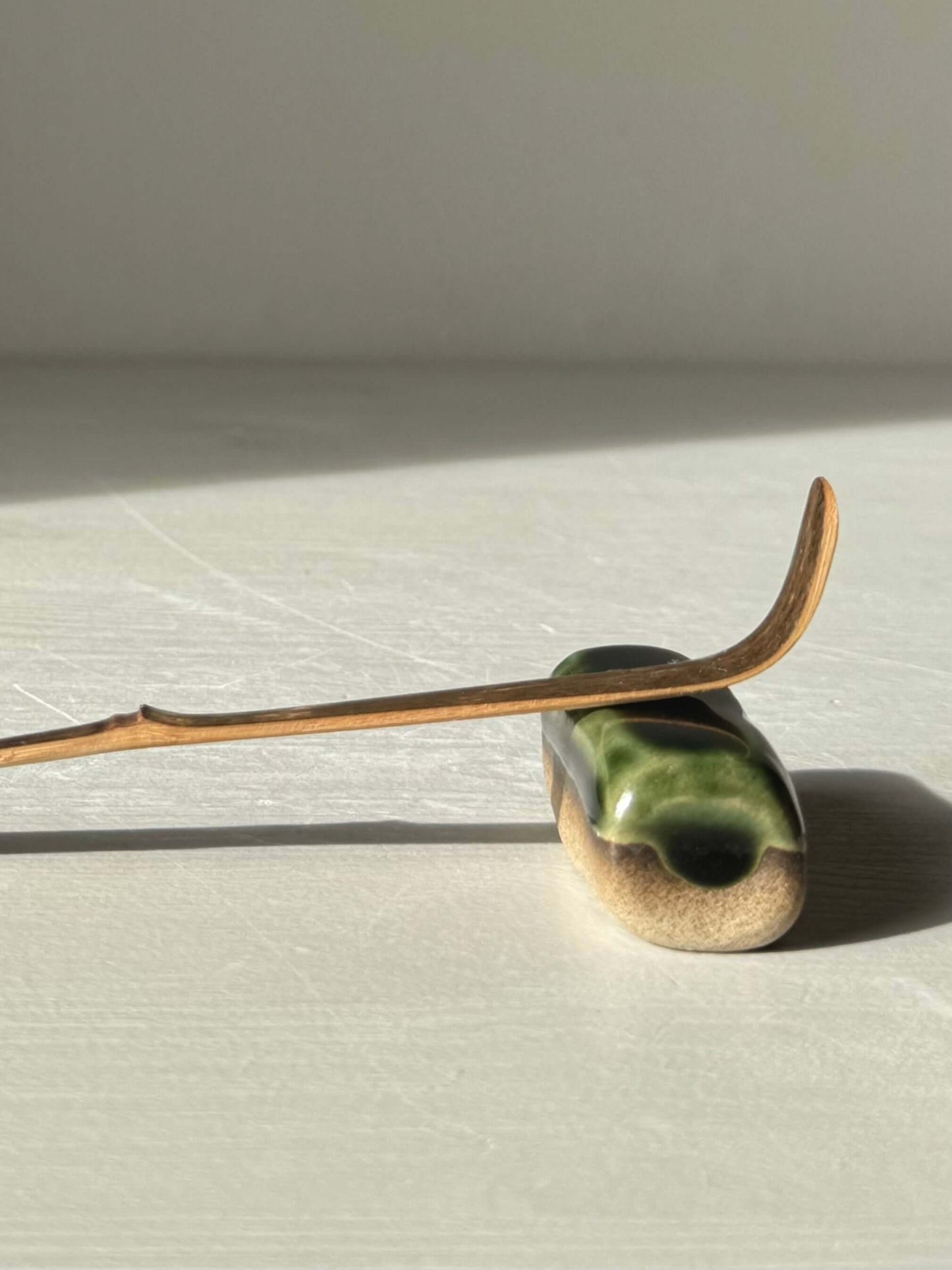 Handmade ceramic Chopstick/Spoon Rest – Mori with glossy green glaze on toffee clay, perfect for slow mornings and quiet dinners.