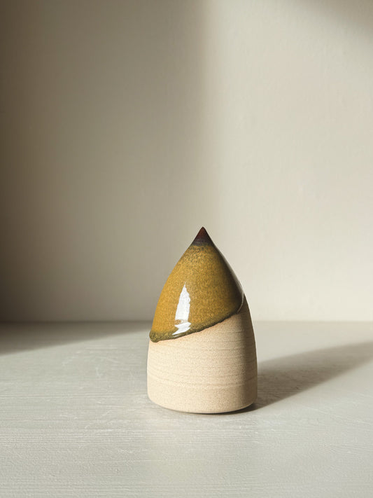 Minimalist Ceramic Christmas Tree – Inyo #01 with glossy Tenmoku glaze on a light surface.
