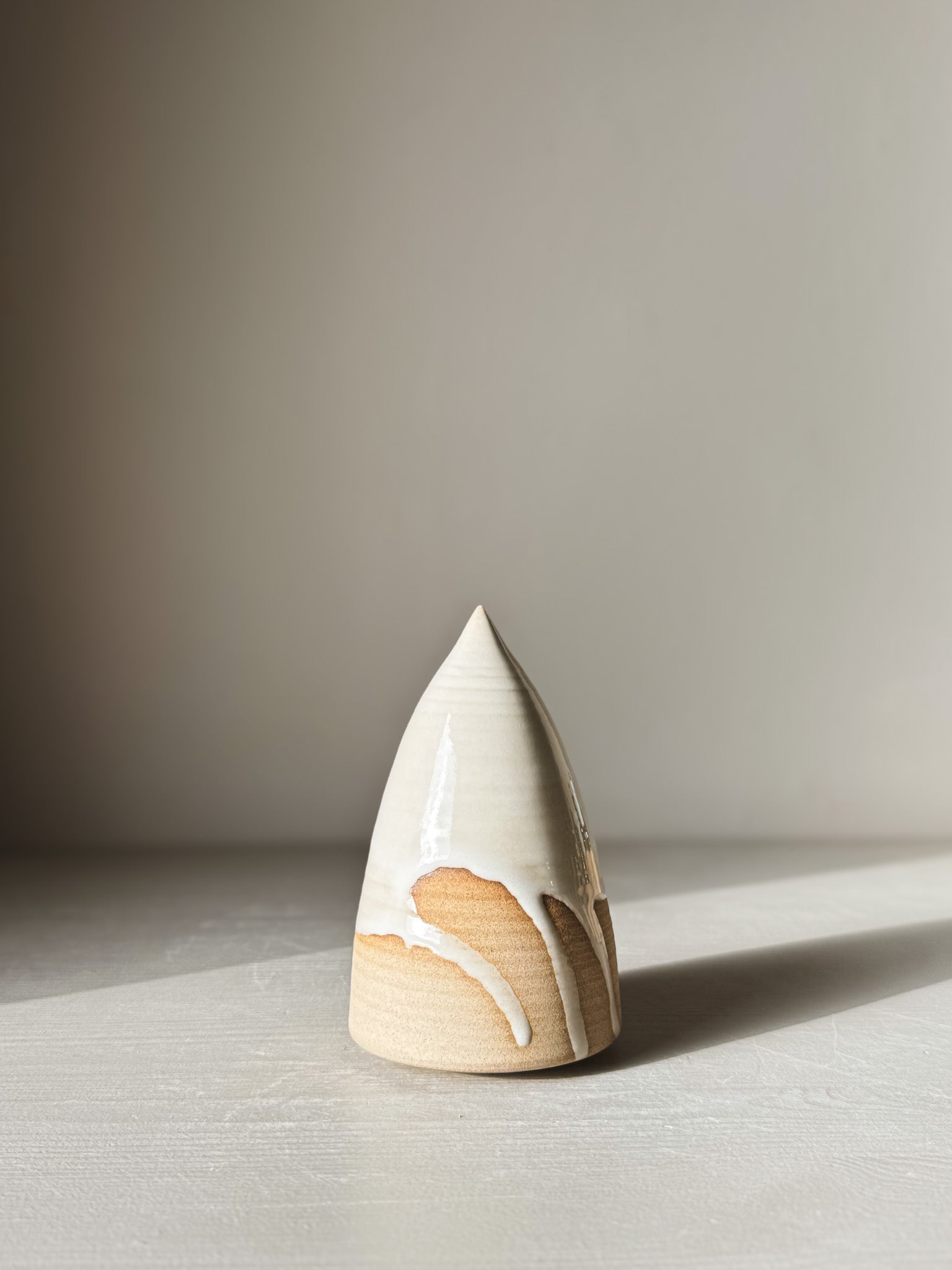 Minimalist Ceramic Christmas Tree – Yuki #02 with glossy white glaze, showcasing unique hand-shaped design and natural clay finish.