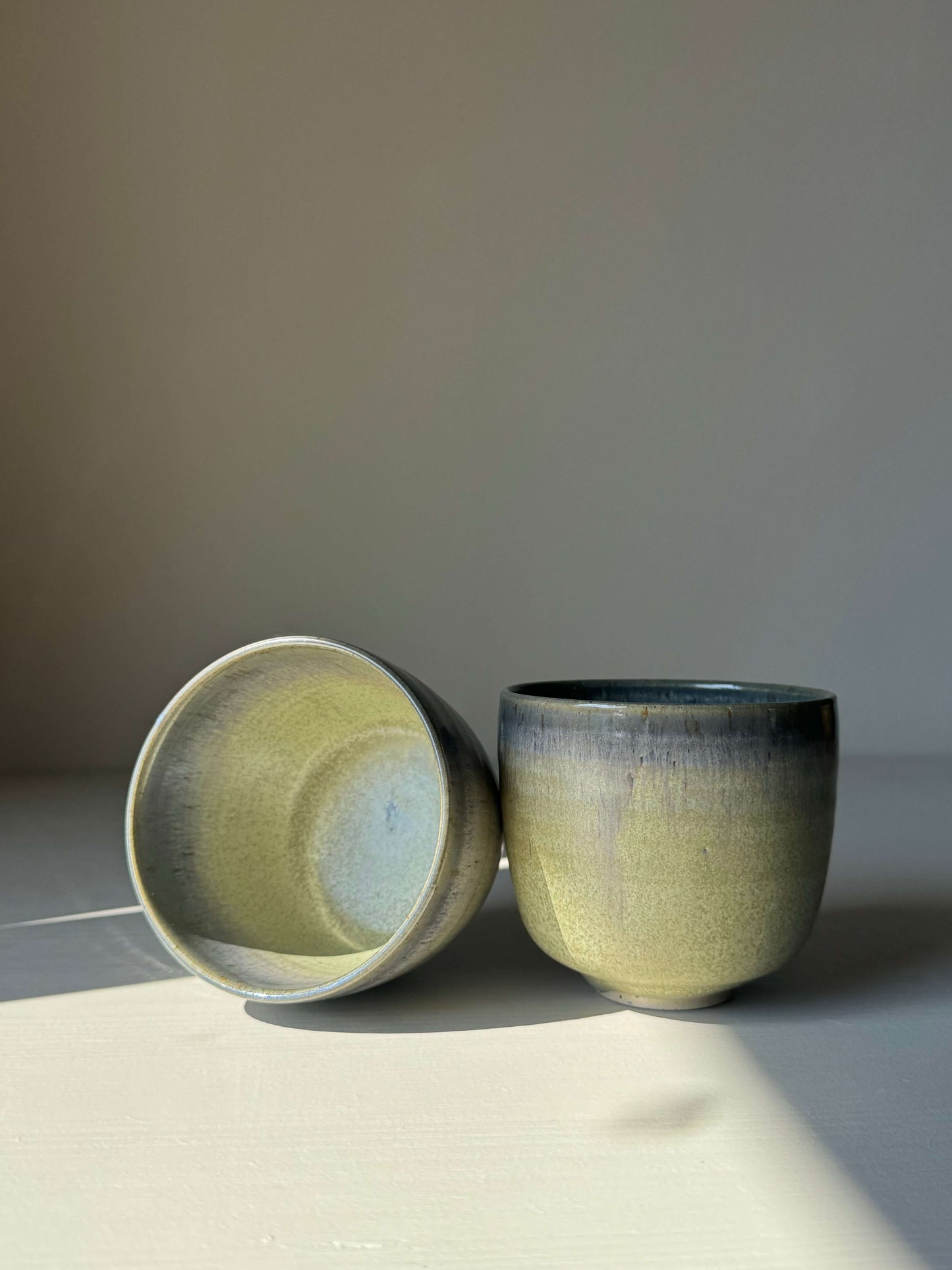 Handmade ceramic Cups - Satin Blue with a misty grey and olive green glaze, rounded shape, perfect for everyday use.