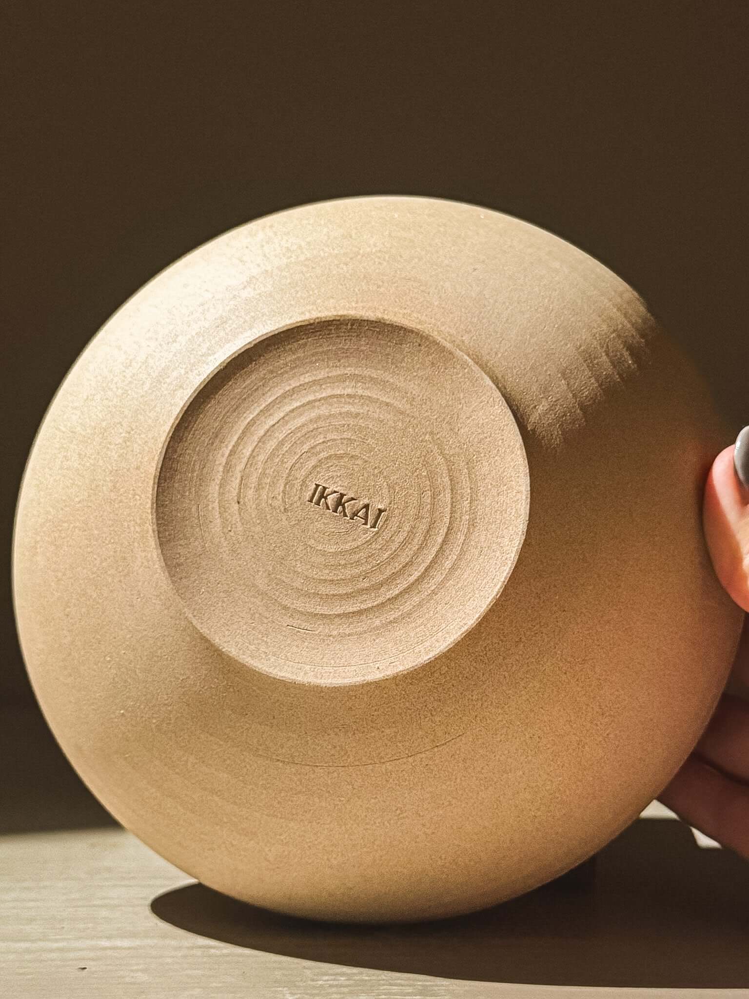 Underside view of Inyo Series handmade double-walled stoneware bowl with toffee-toned clay finish and subtle throwing lines.