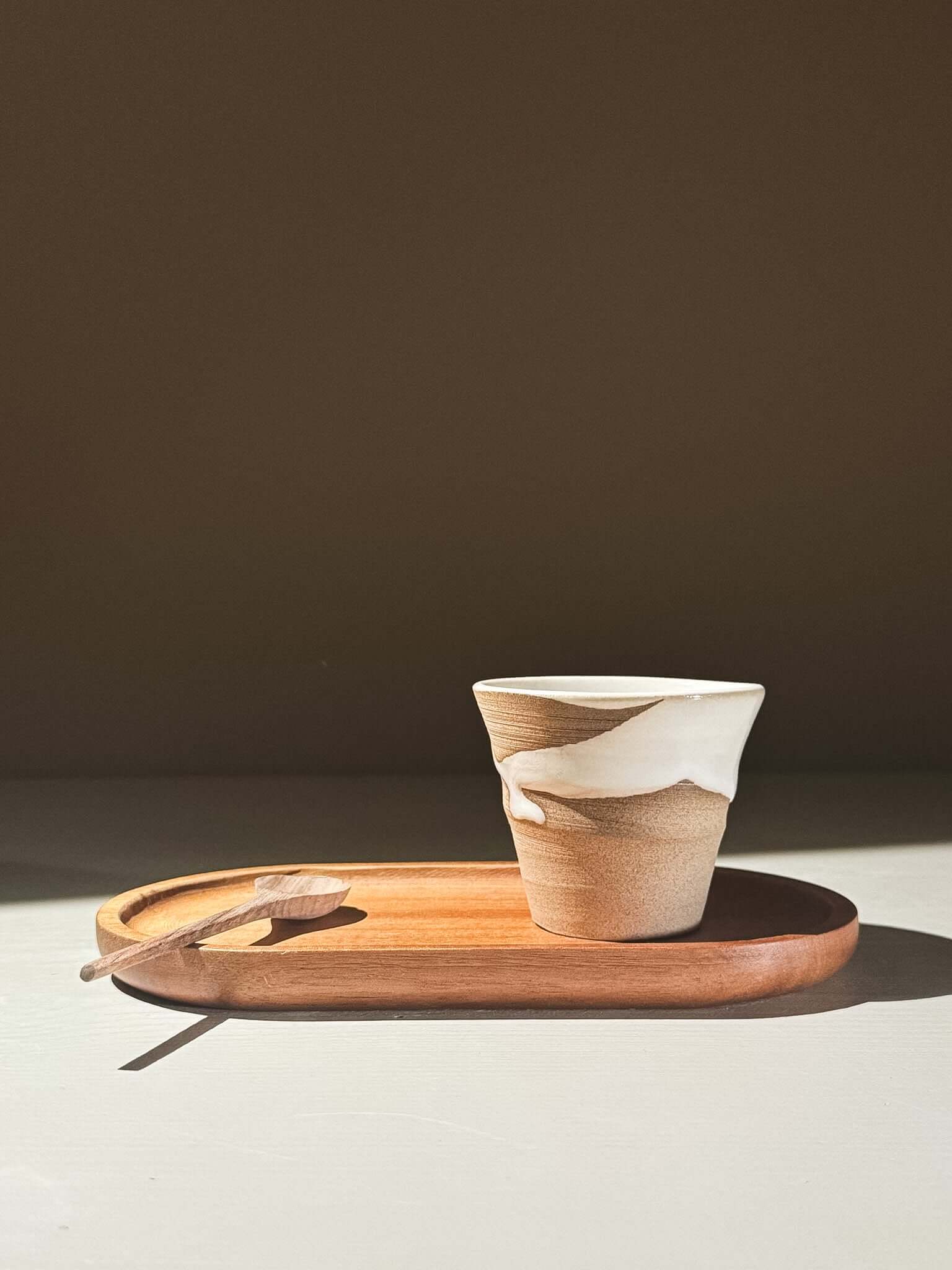 Espresso Cup - Yuki #01 on wooden tray with spoon, showcasing glossy white glaze and handcrafted character.