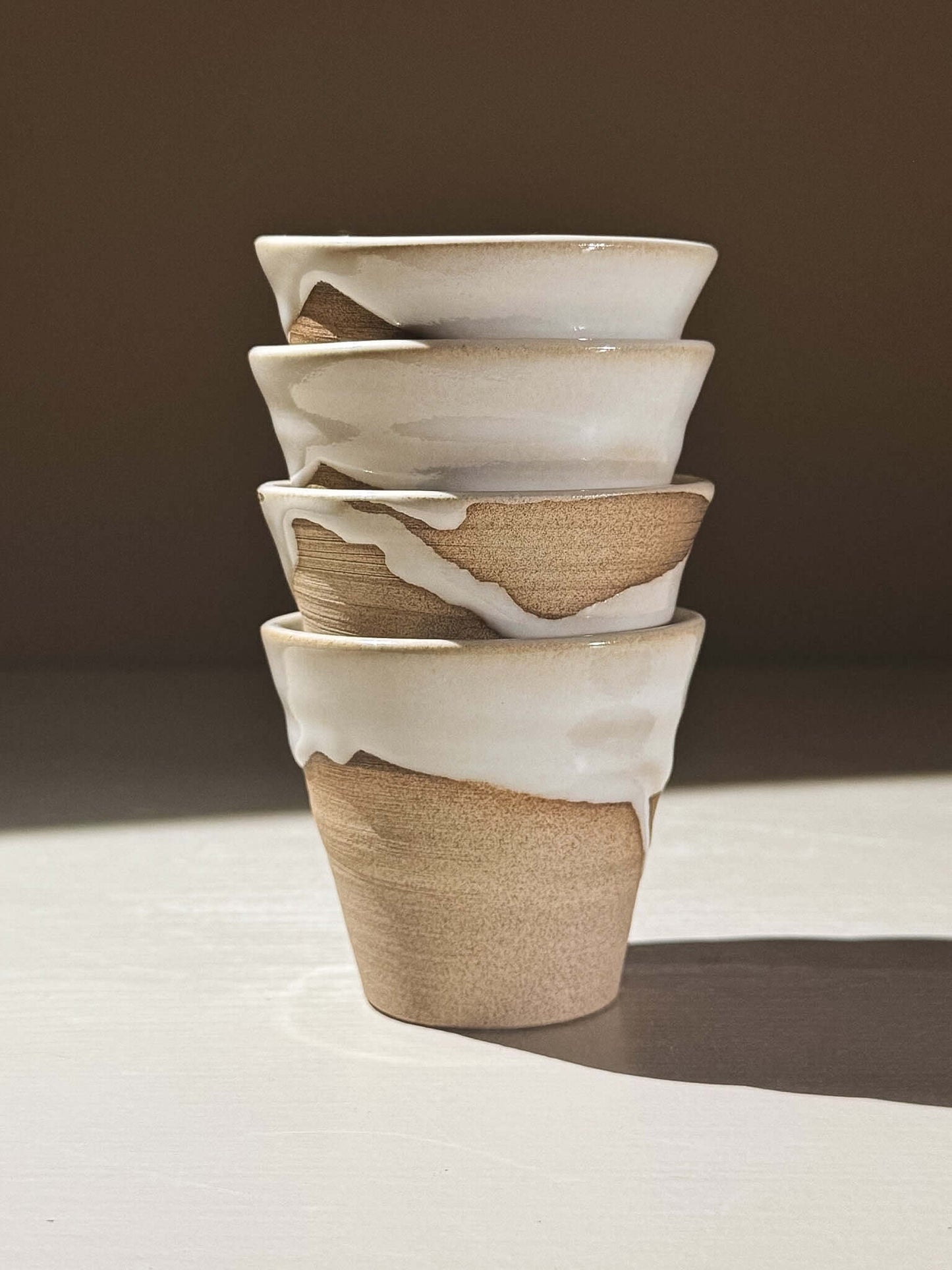 Espresso Cup - Yuki #01 stacked, showcasing the glossy white glaze and warm toffee-toned clay.