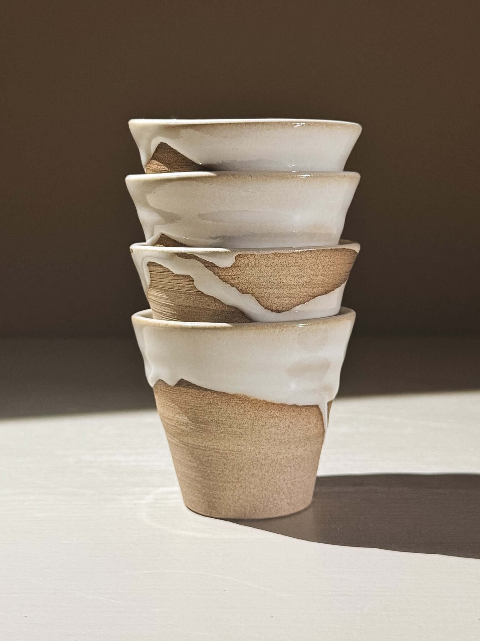 Espresso Cup - Yuki #01 stacked, showcasing the glossy white glaze and warm toffee-toned clay.