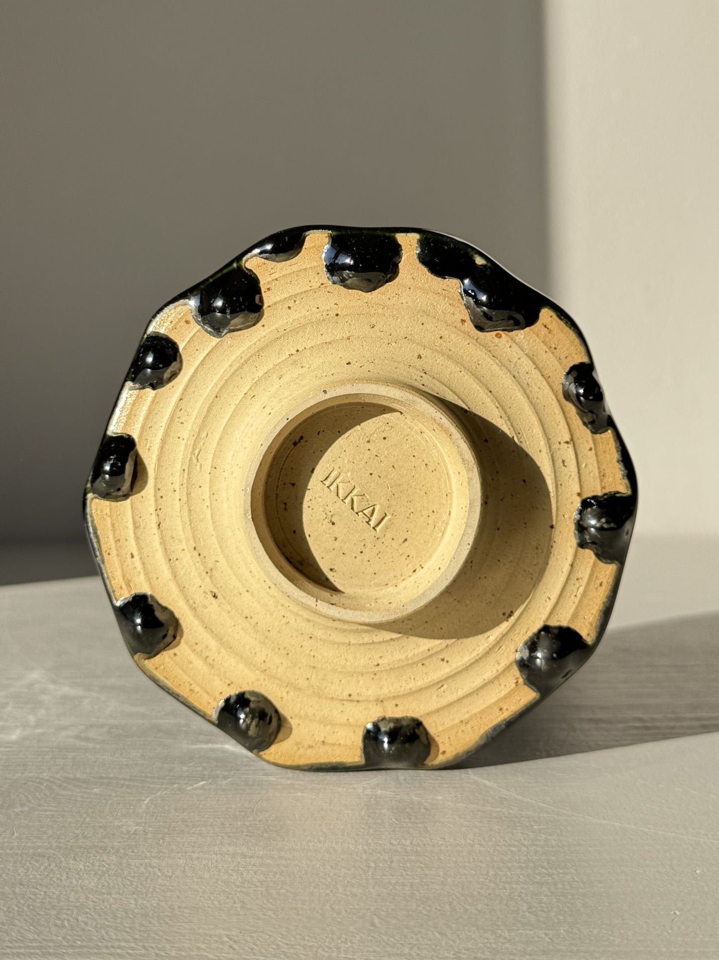 Underside view of Faceted Matcha Bowl - Hinoki #01, showcasing hand-carved facets and glaze drip details, part of Hinoki Series.