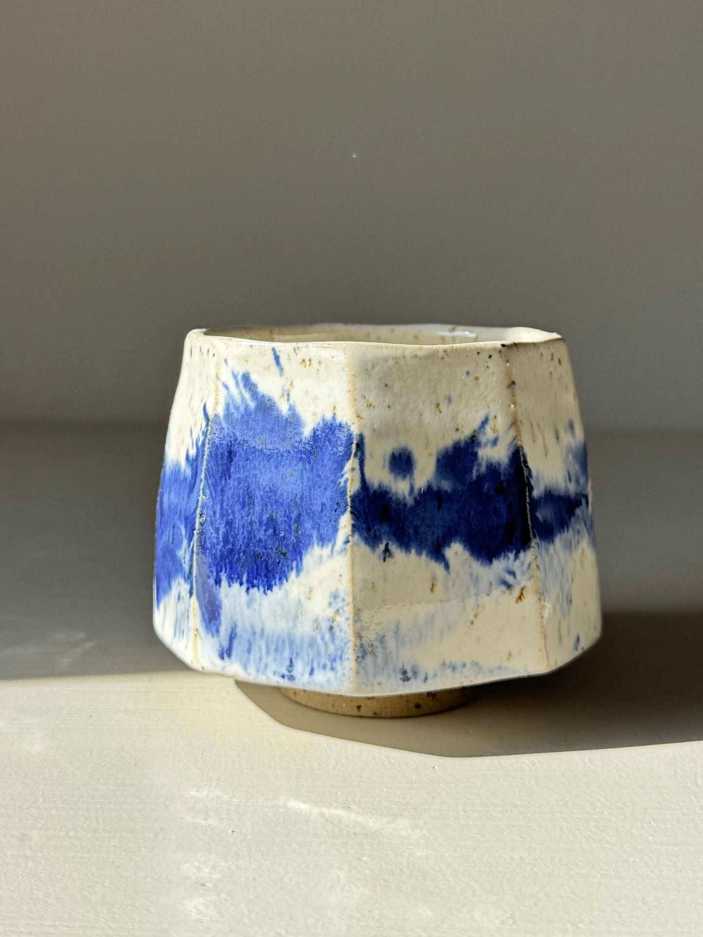 Faceted Cup – Cobalt Blue & Glossy White #03, handmade ceramic with unique blue glaze design.