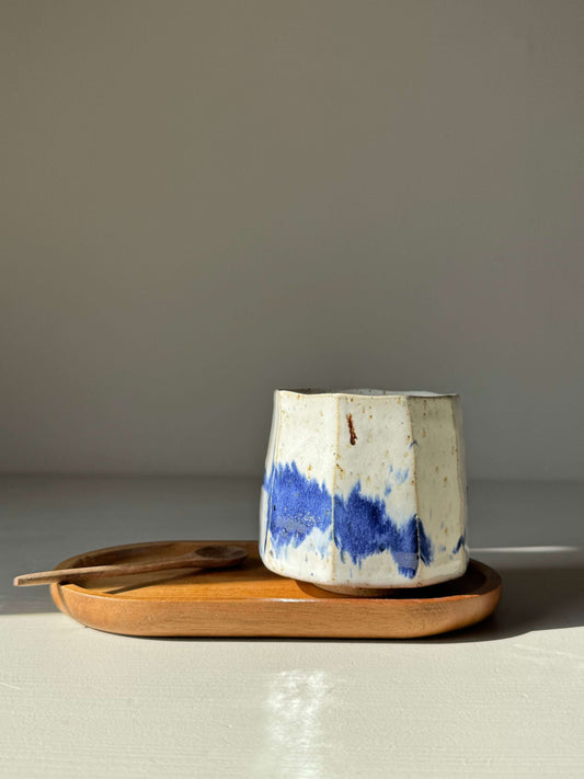 Handmade ceramic Faceted Cup – Cobalt Blue & Glossy White #01 on a wooden tray