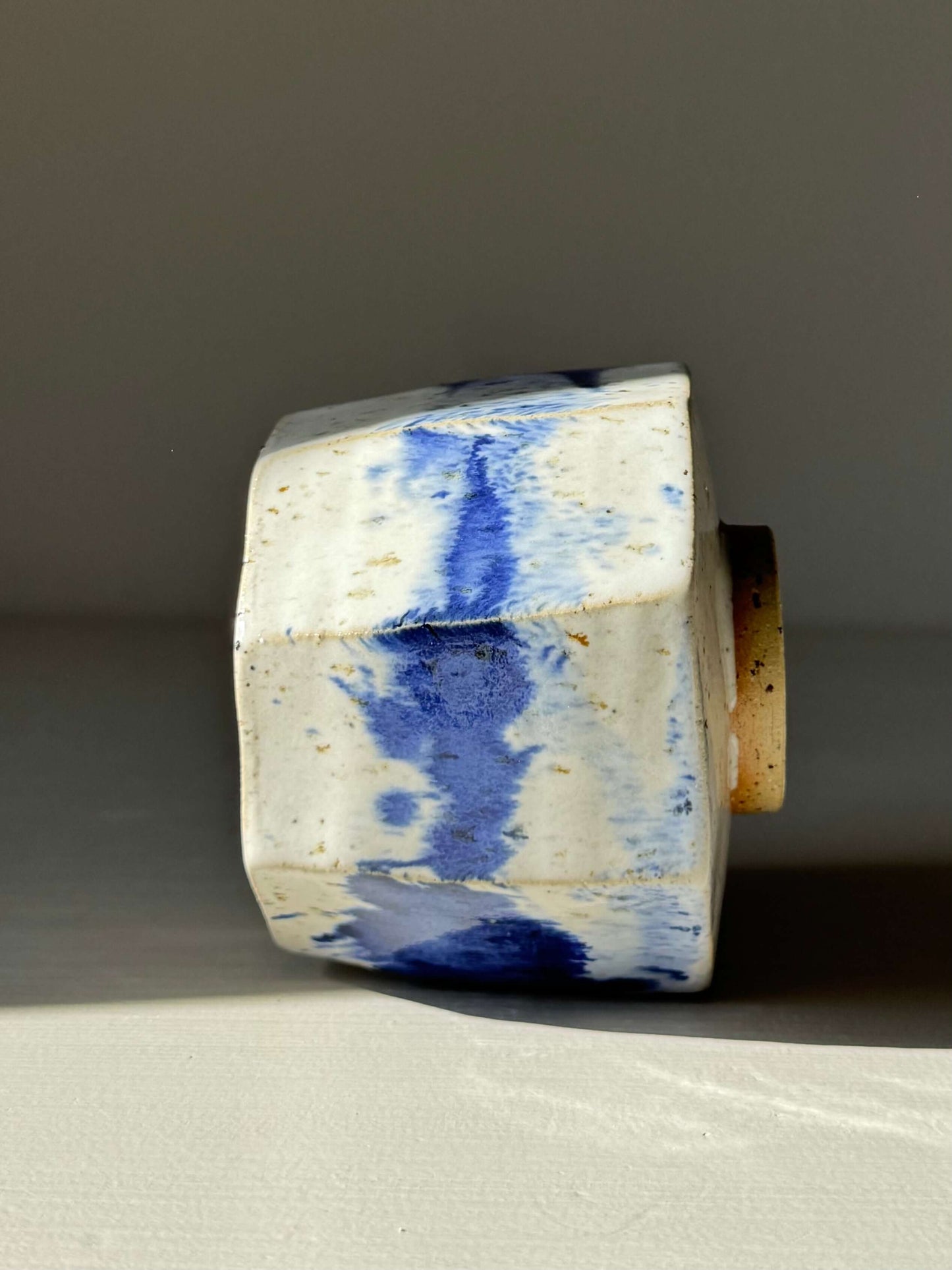 Handmade ceramic Faceted Cup – Cobalt Blue & Glossy White #03 with crisp angles and unique blue glaze design.