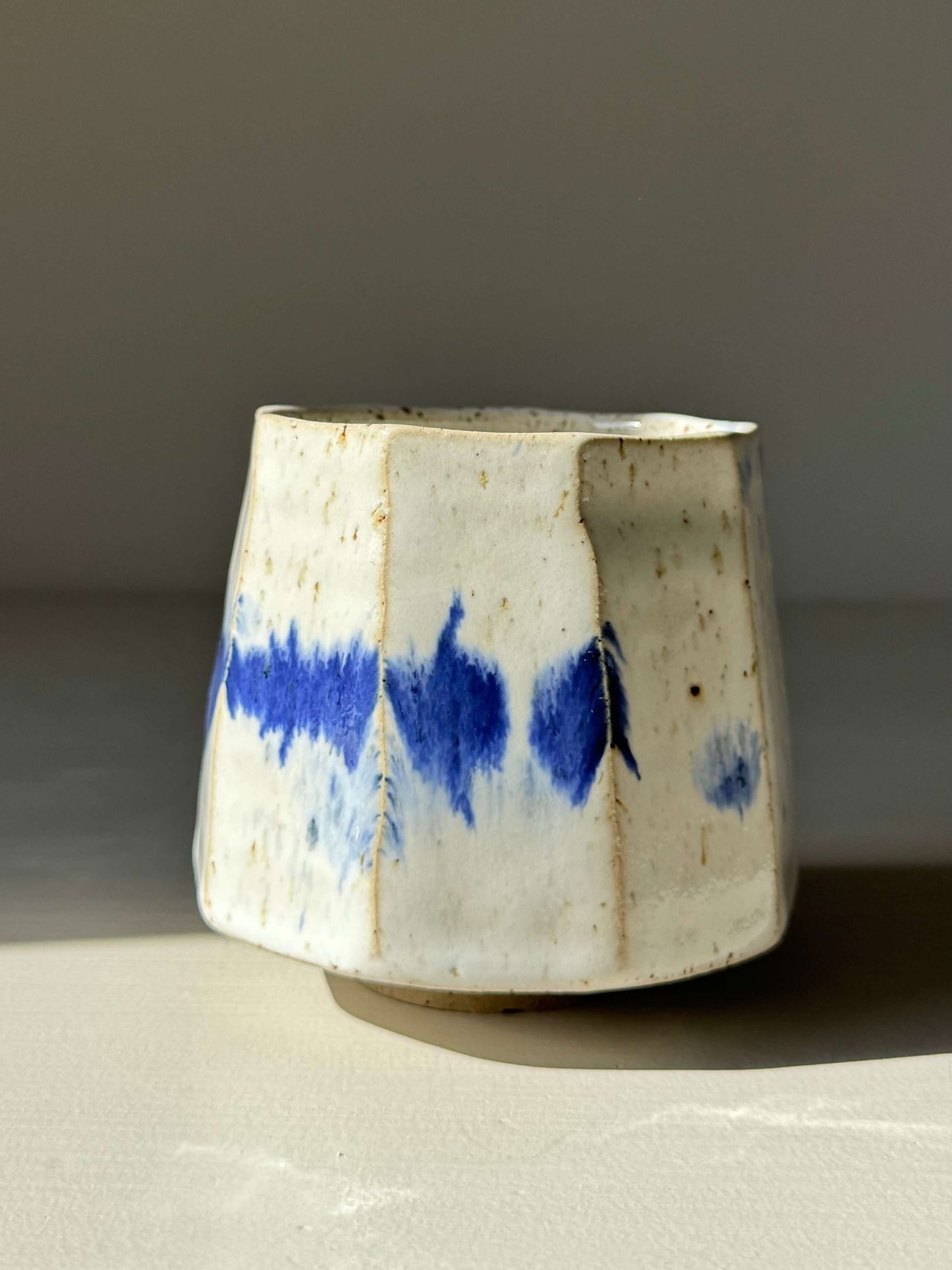 Handmade ceramic Faceted Cup – Cobalt Blue & Glossy White #02 with unique brushstrokes and angled design.