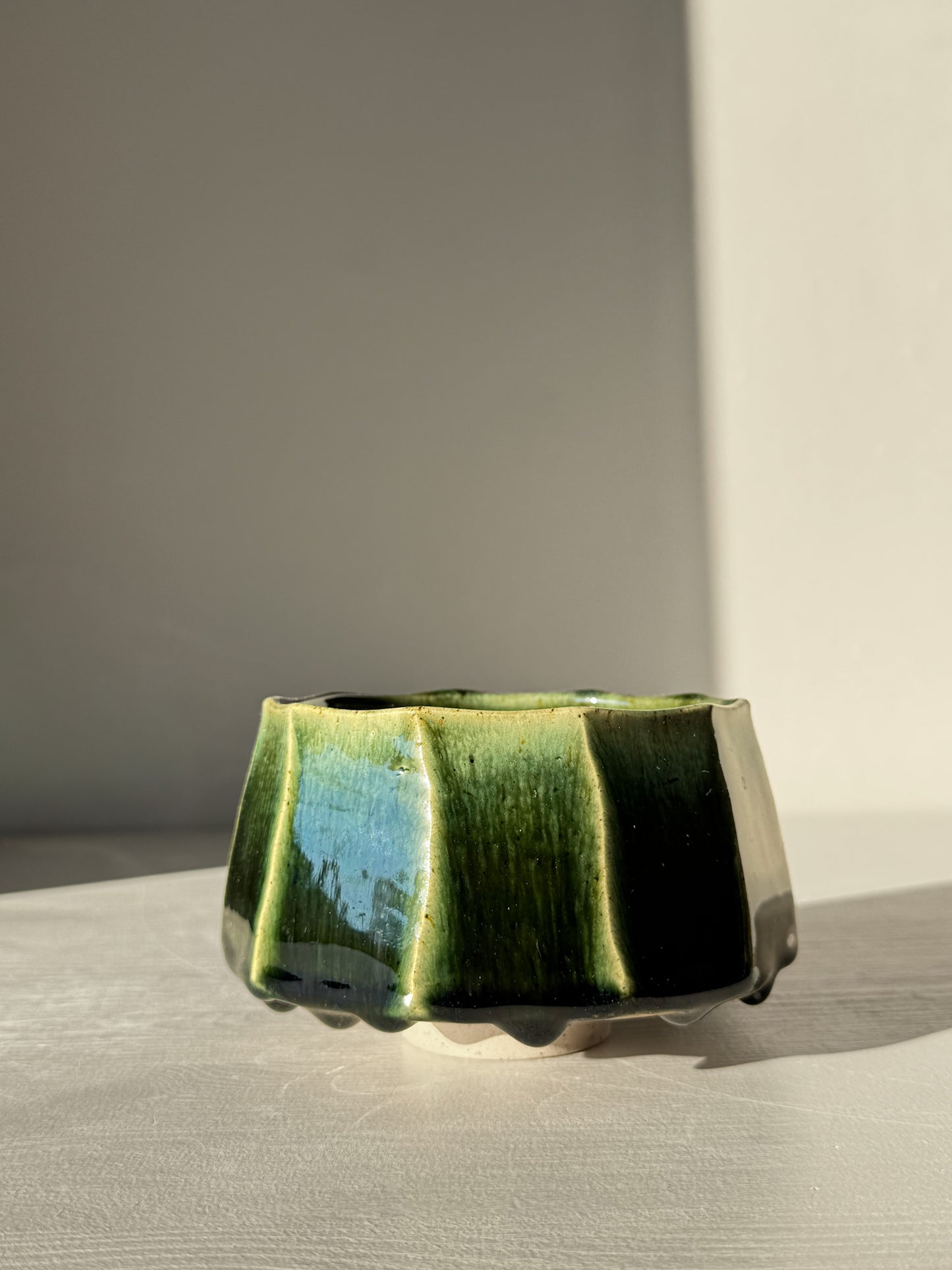Faceted Matcha Bowl - Hinoki #03 with deep green glaze and hand-carved facets, showcasing intricate design and craftsmanship.