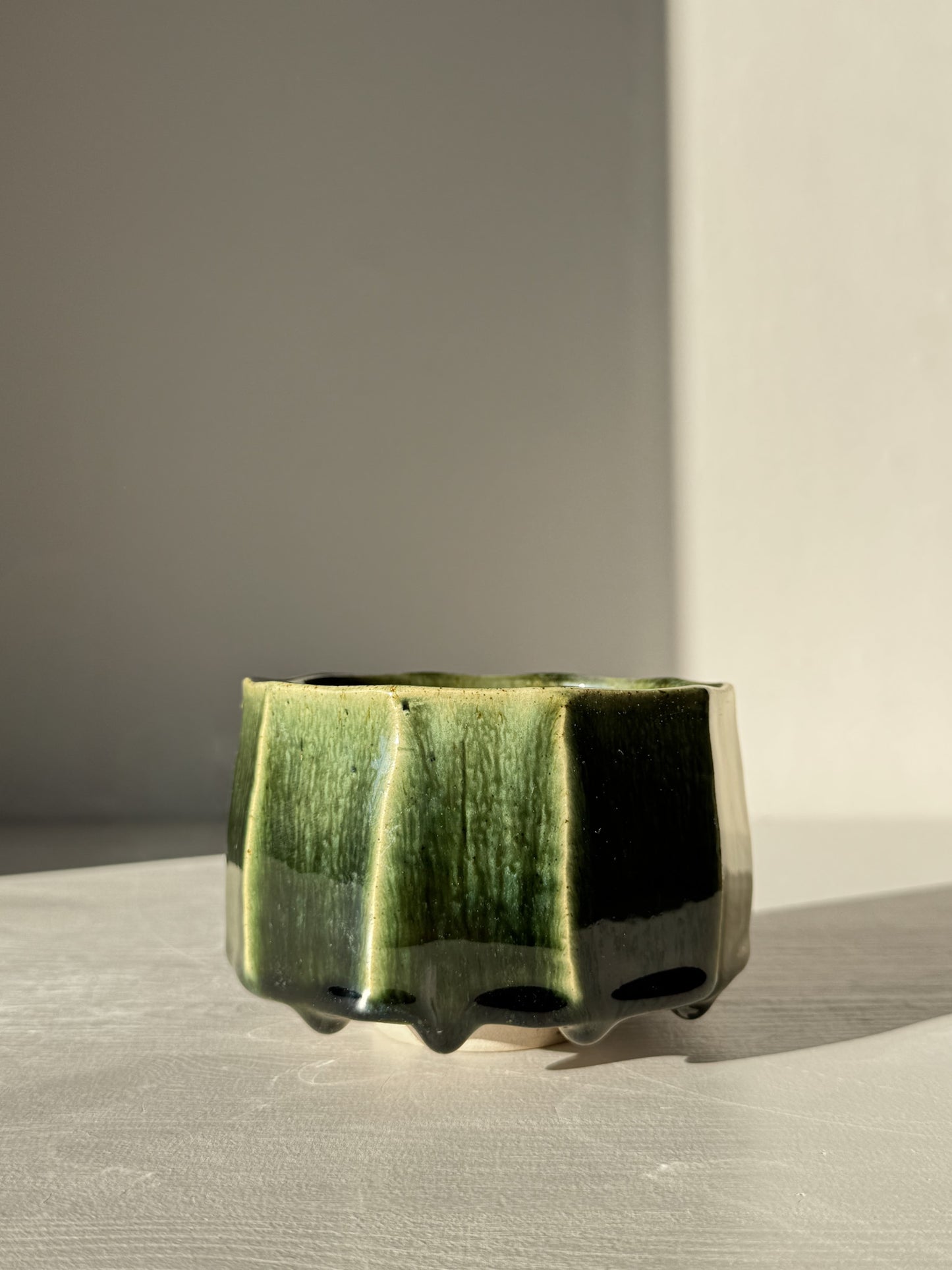Faceted Matcha Bowl - Hinoki #01 with deep green glaze and hand-carved facets, part of the Hinoki Series, highlighting its distinctive design.