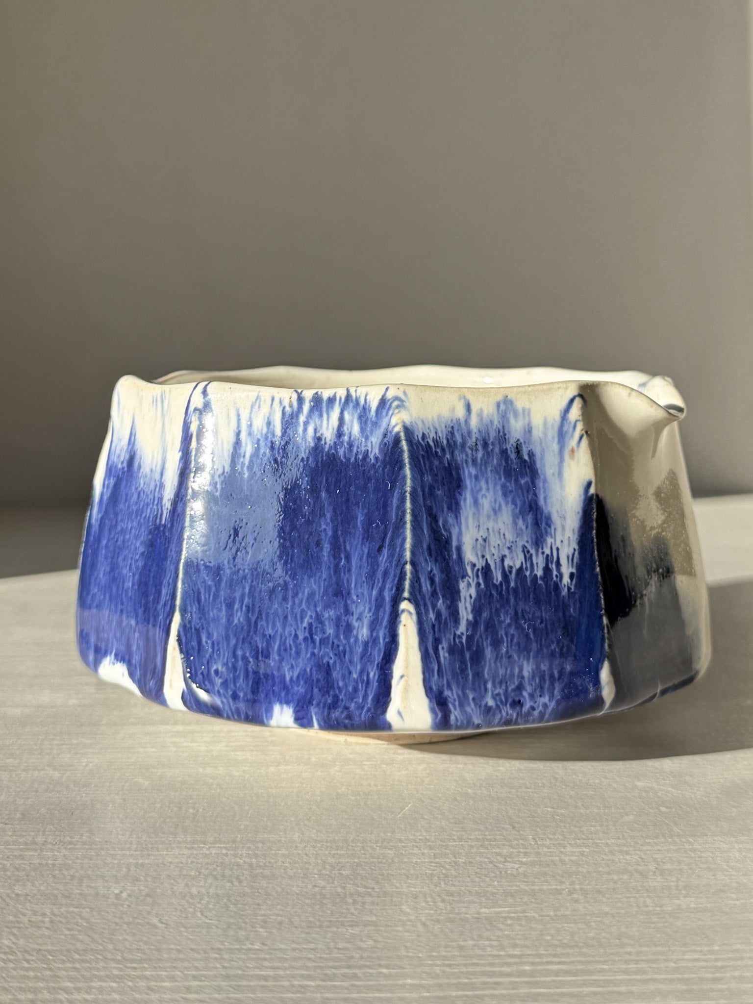 Faceted Matcha Bowl with Spout – White & Blue #02 featuring a unique faceted design with cobalt blue accents on a white glaze.