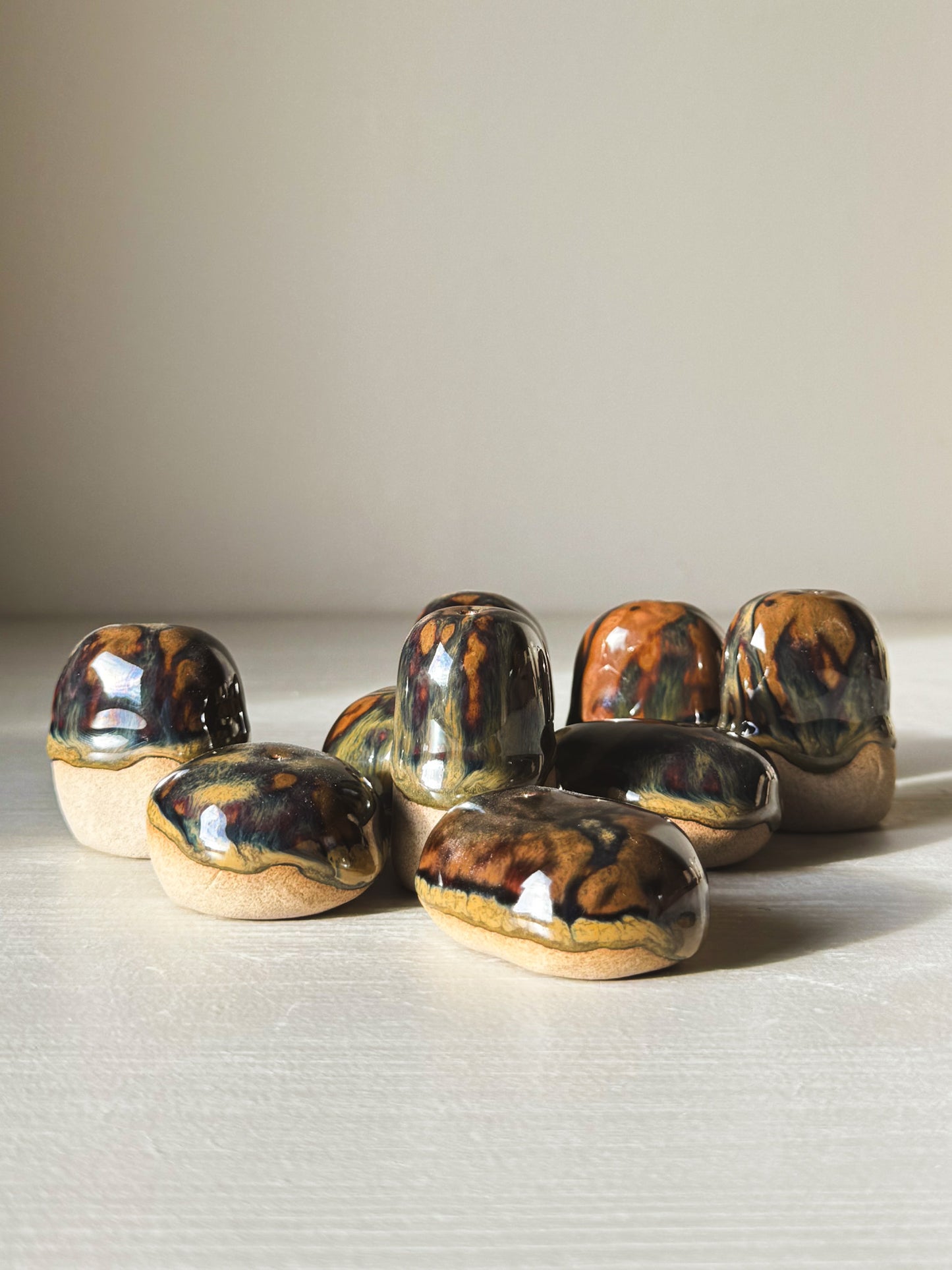 Hand-formed Incense Holder Pebbles in glazed stoneware, resembling smooth river stones and ideal for holding a single incense stick.