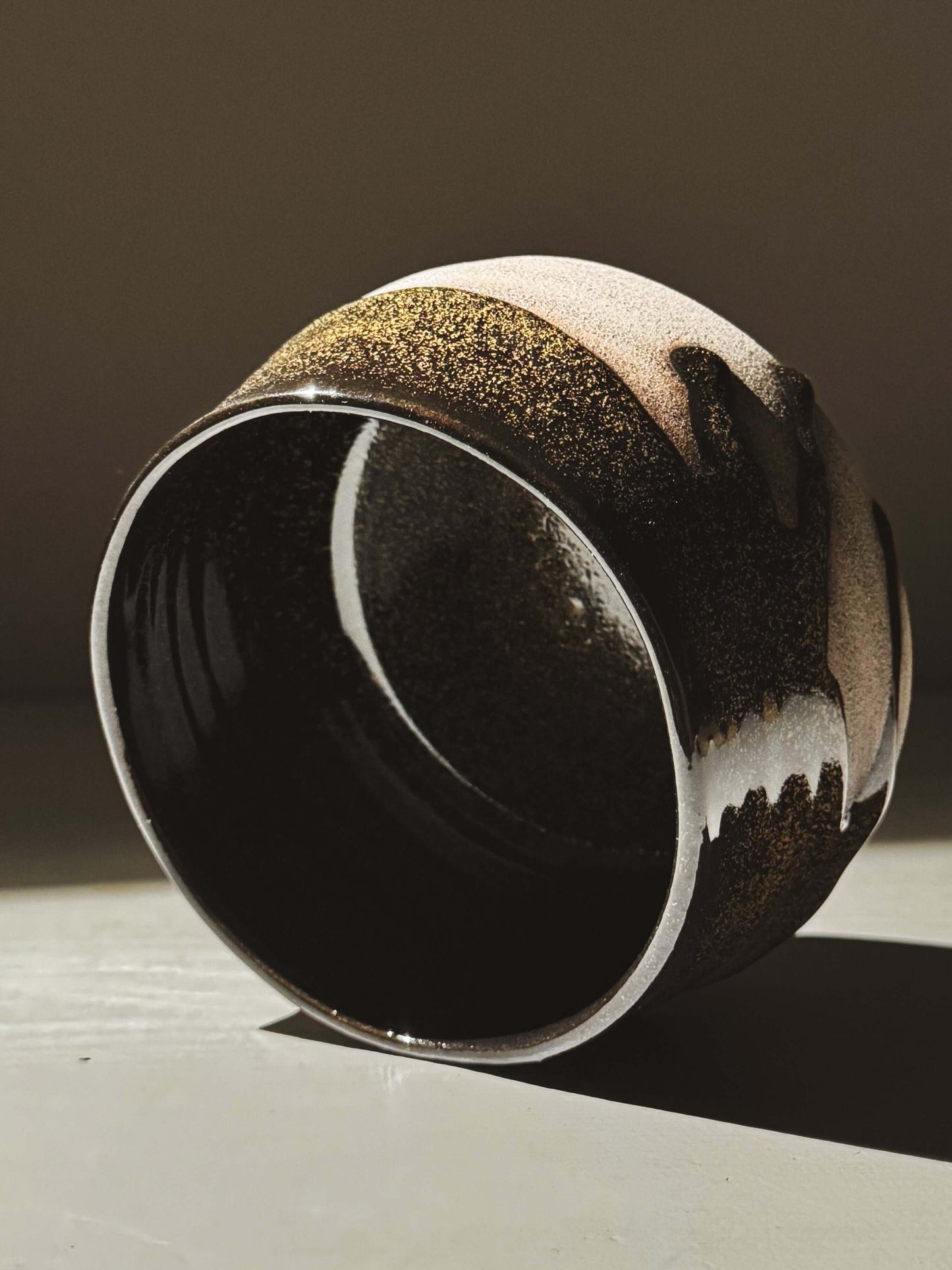 Matcha Bowl – Kuro Ash #01 with glossy black glaze and ash-grey clay, showcasing handcrafted wheel-thrown design.