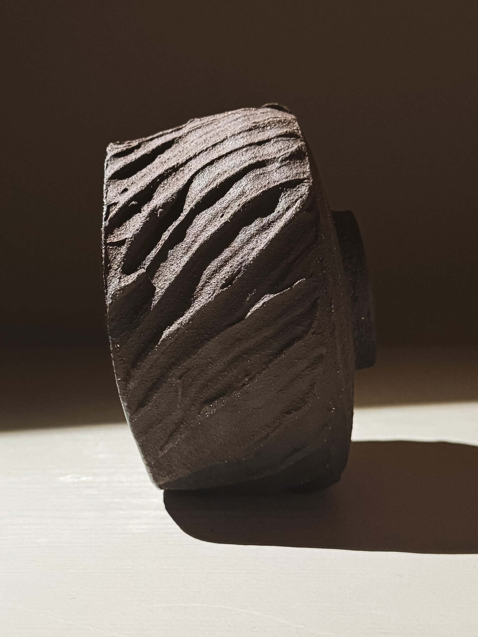 Kuro Matcha Bowl #04 with textured dark brown slip exterior and glossy dark glaze interior
