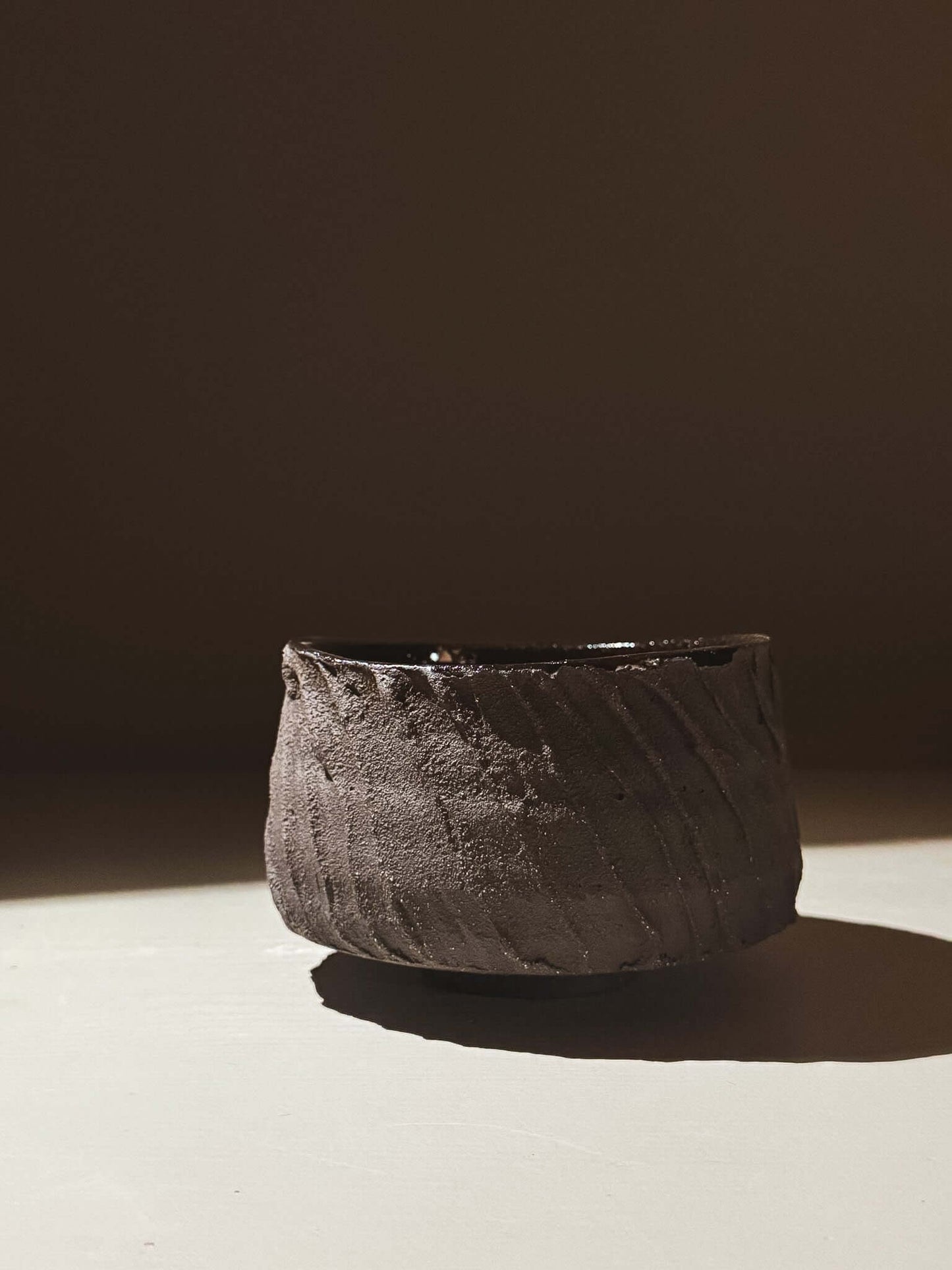 Kuro Matcha Bowl #04 with textured dark slip exterior and glossy interior