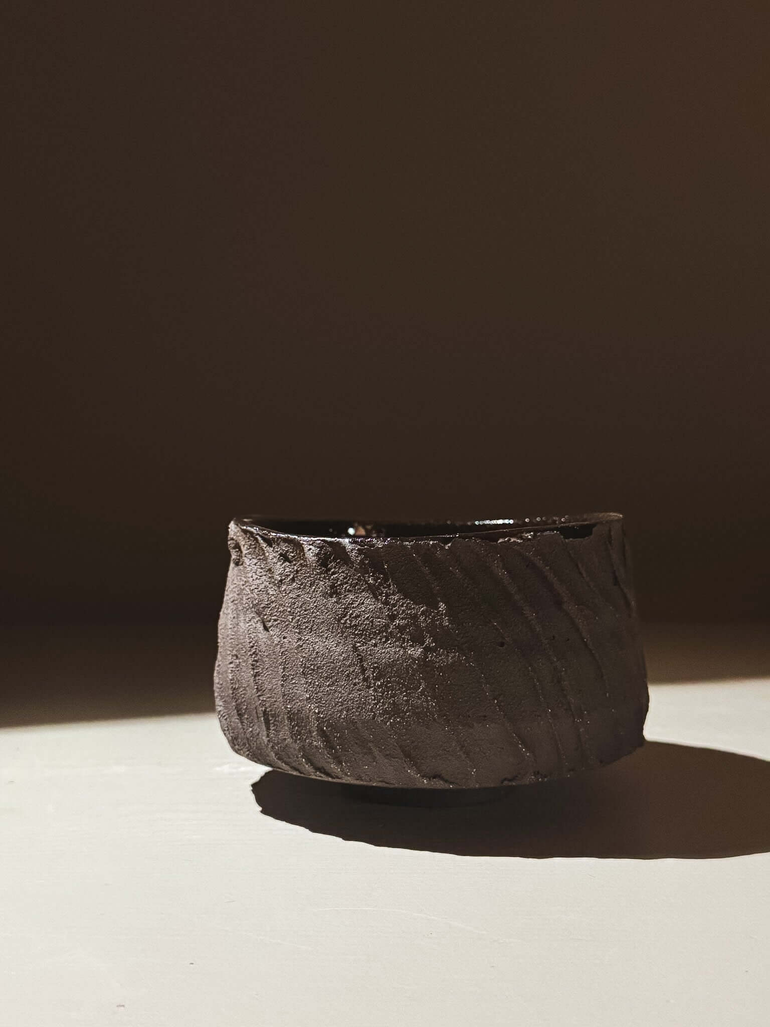 Kuro Matcha Bowl #04 with textured dark slip exterior and glossy interior