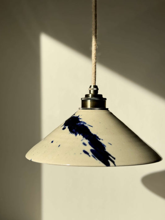 Handmade ceramic lamp shade from the Gosu Series, featuring bold cobalt blue accents and glossy finish. Unique and artisanal.