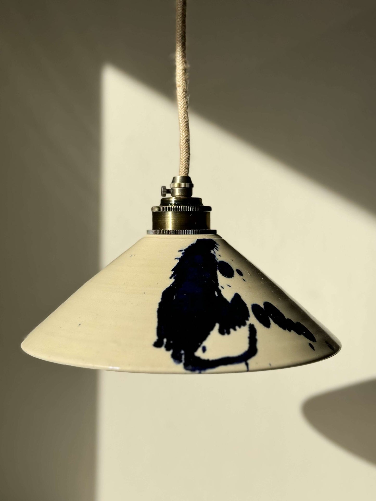 Handmade ceramic lamp shade from the Gosu Series with cobalt blue splashes, showcasing unique artistry and dynamic style.