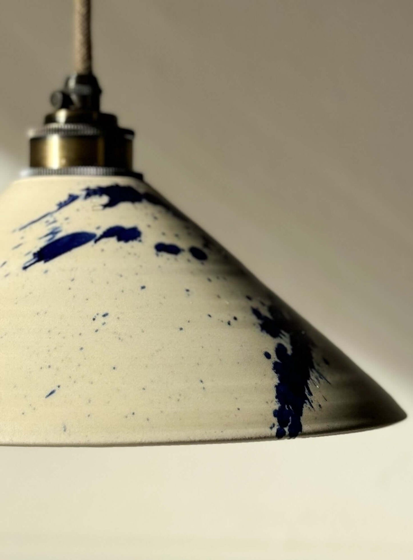 Ceramic lamp shade from Gosu Series with cobalt blue accents, showcasing handmade craftsmanship and unique design.