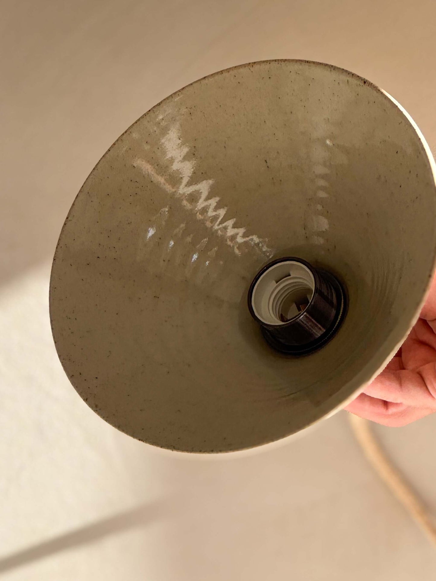 Close-up of Ceramic Lamp Shade – Half Clear Glaze #01 showing handmade ceramic design with unglazed exterior and smooth interior.