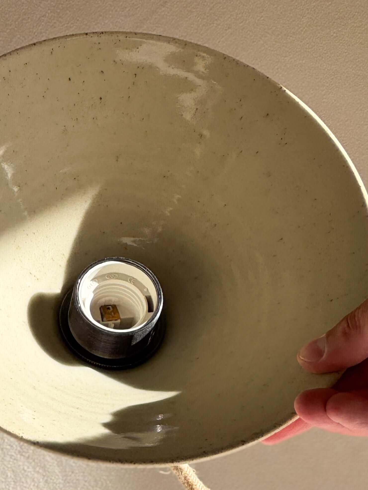 Handmade Ceramic Lamp Shade – Half Clear Glaze #01 with unglazed matte finish and clear glazed interior, capturing warm, cozy light reflection.