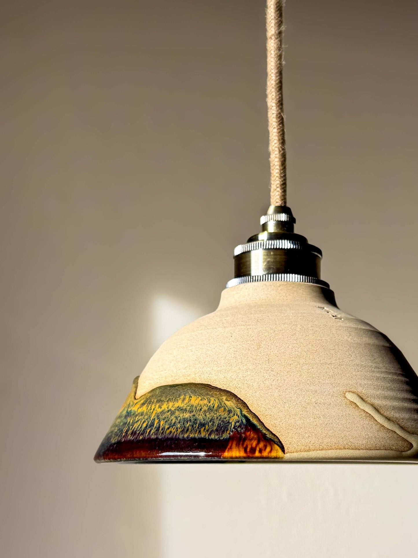 Handmade Ceramic Lamp Shade – Inyo #01 with glossy glaze and natural soft surface, showcasing rich bronze and blue tones.