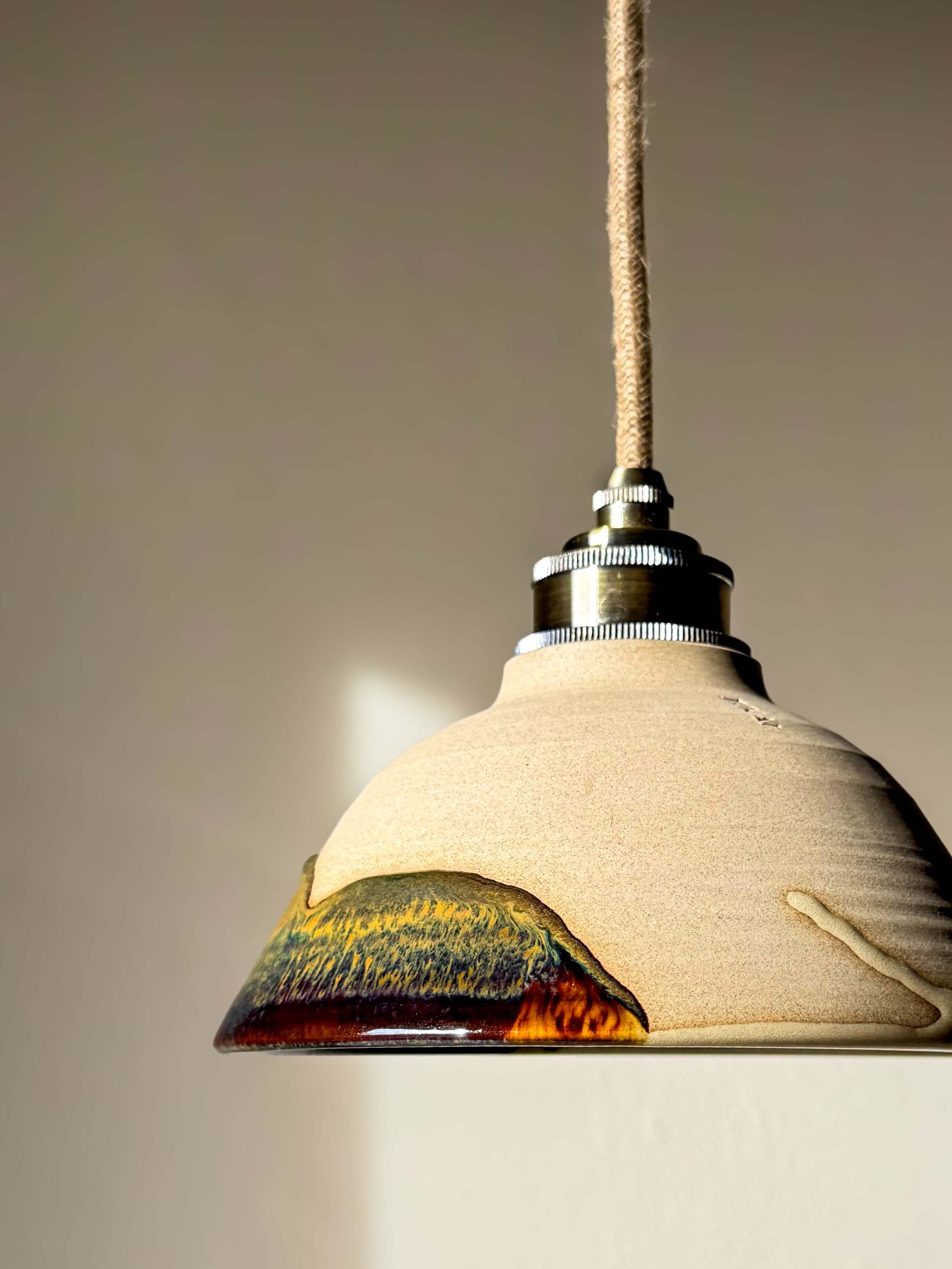 Handmade Ceramic Lamp Shade – Inyo #01 with glossy glaze and natural soft surface, showcasing rich bronze and blue tones.