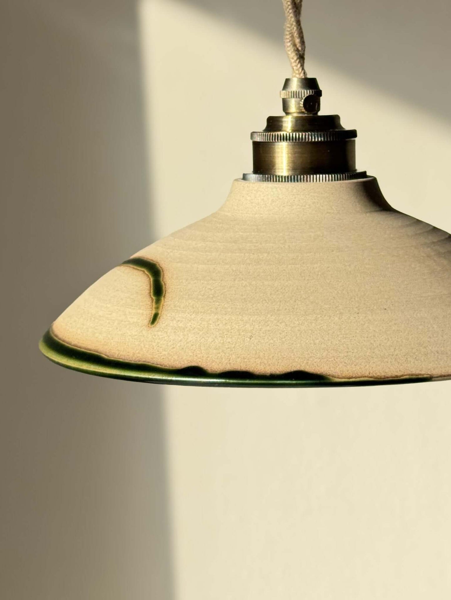 Ceramic Lamp Shade – Mori #02 with handmade ceramic design in soft natural tones and forest green glaze, showcasing organic craftsmanship.