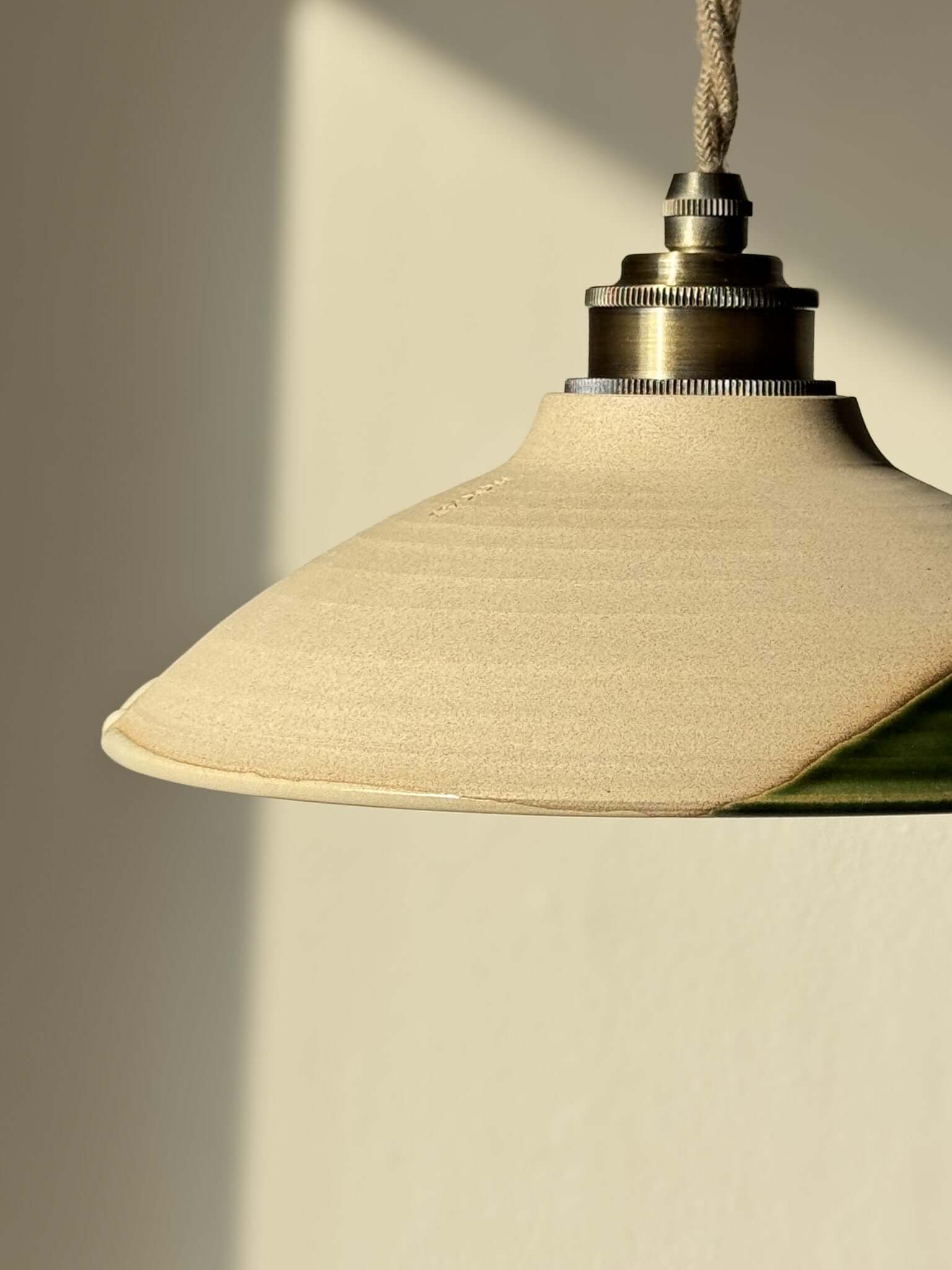 Handmade Ceramic Lamp Shade – Mori #02 in natural tones and forest green, showcasing a calm organic design with raw clay texture.