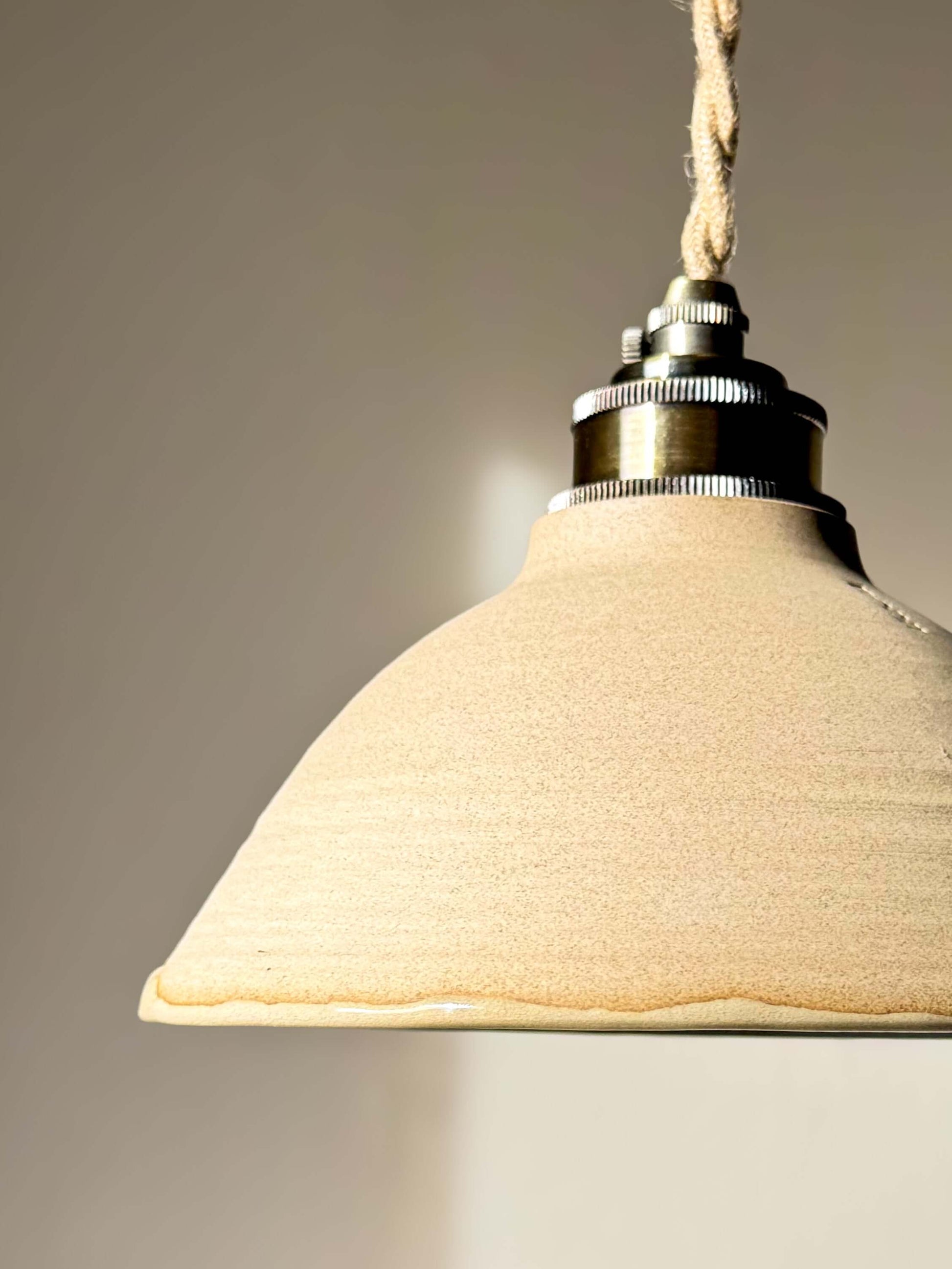 Handmade Ceramic Lamp Shade – Mori #01 with forest green glossy glaze, showcasing organic design and quiet beauty of clay.