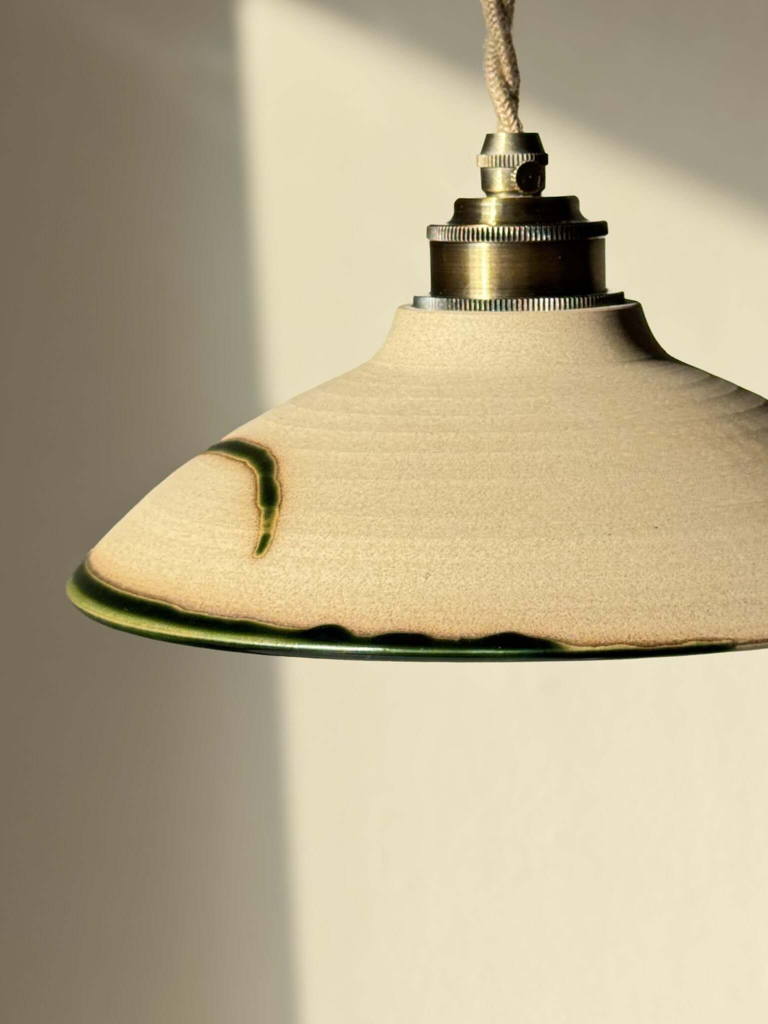 Ceramic Lamp Shade – Mori #02 with handmade ceramic design in soft natural tones and forest green glaze, showcasing organic craftsmanship.