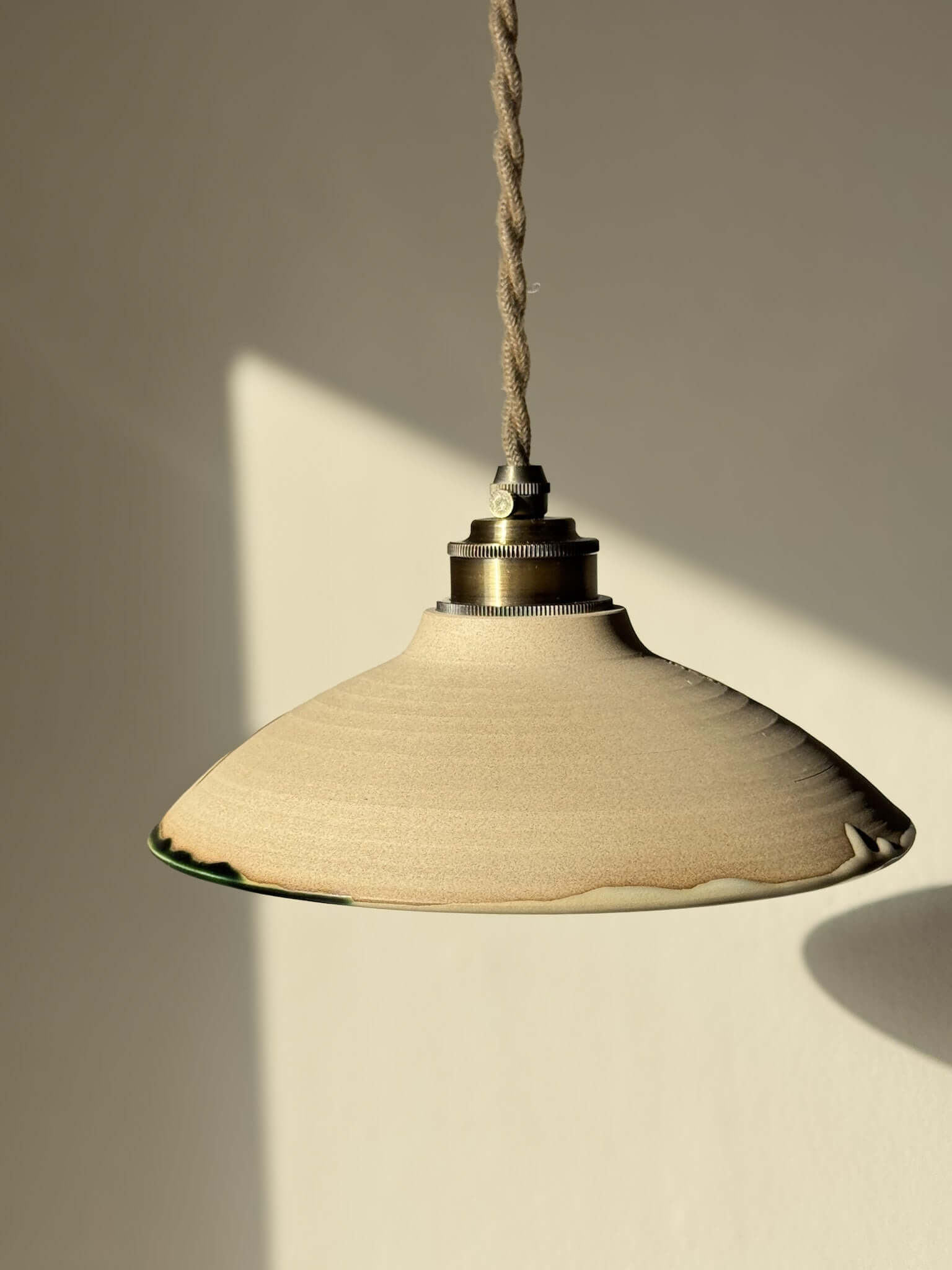 Ceramic Lamp Shade – Mori #02, handmade in soft natural tones with forest green glaze, creating an organic and calming design.