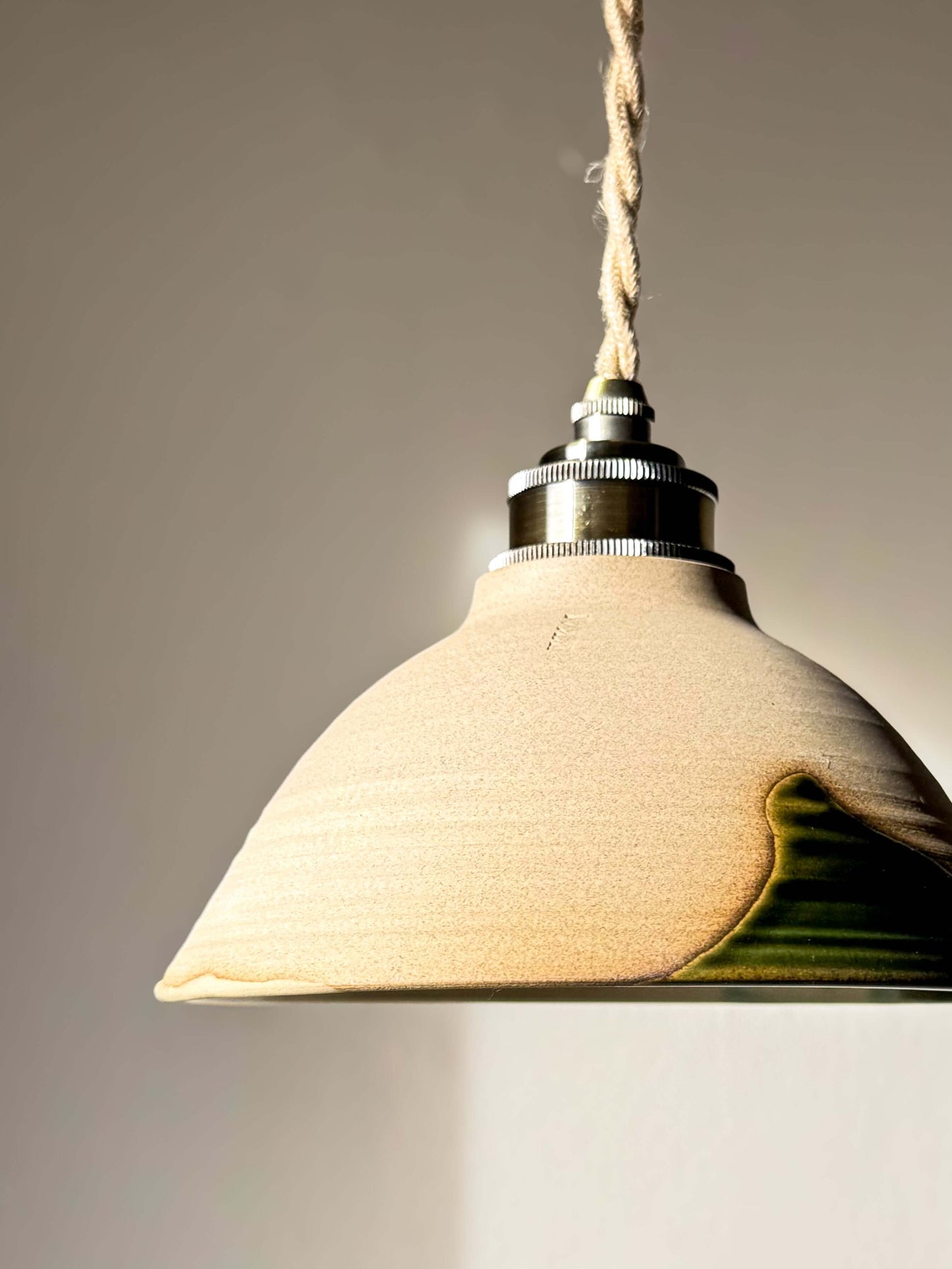 Ceramic Lamp Shade – Mori #01, handmade ceramic with forest green glaze, showcasing raw clay texture and organic design.
