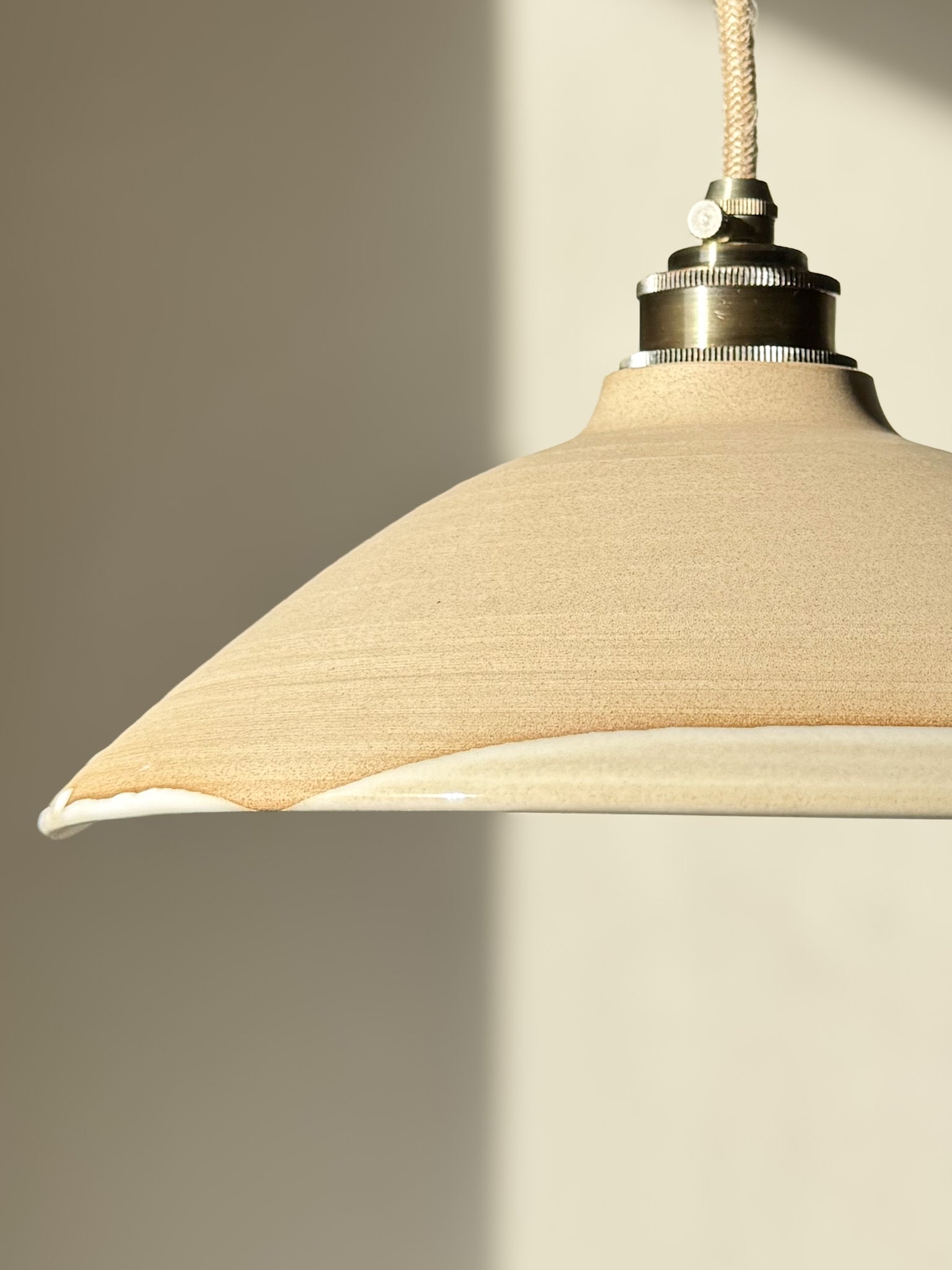 Ceramic Lamp Shade – Yuki #01 featuring snowy tones and raw clay texture with organic curves and creamy glaze detail.