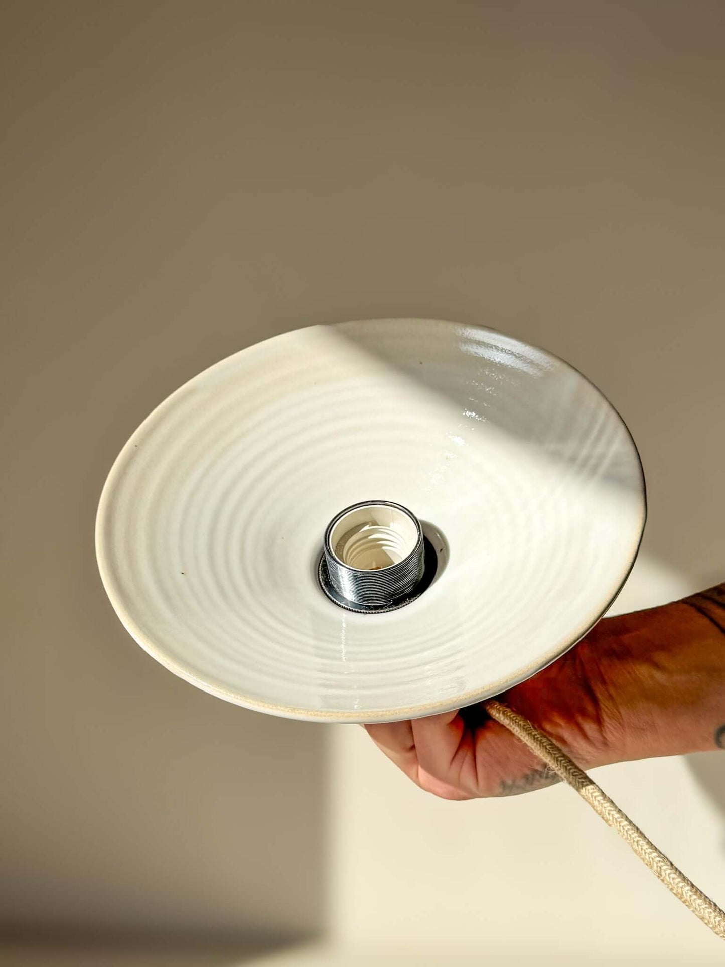 Lamp Shade – Yuki #02 - Custom order held in hand, showcasing glossy white interior and clay-like exterior with creamy glaze line.