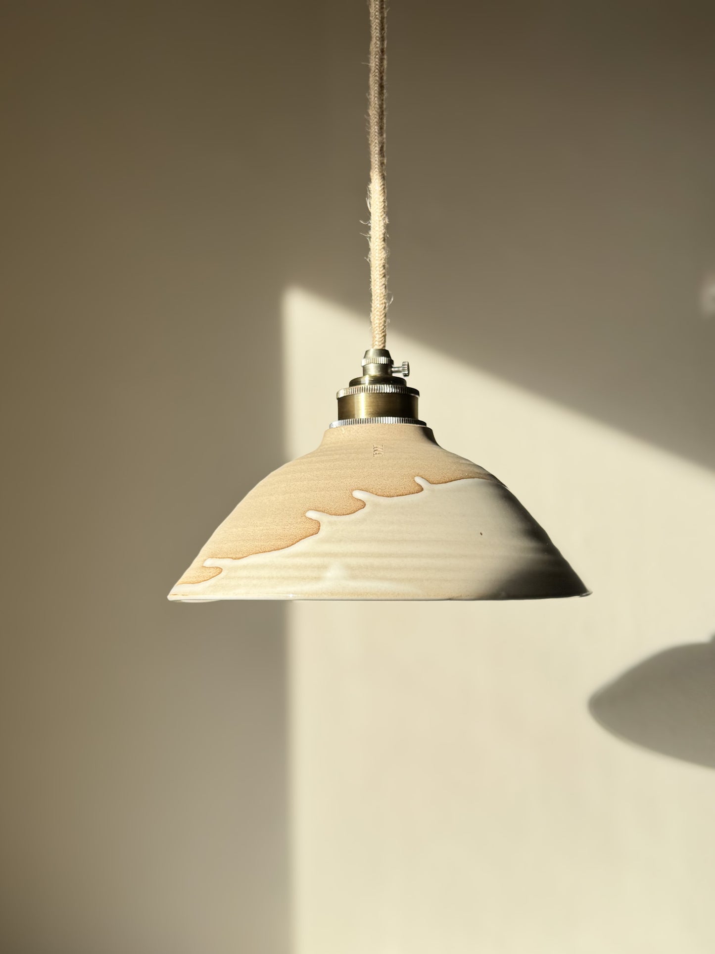 Ceramic Lamp Shade – Yuki #02 with glossy white glaze and warm raw clay design, featuring a creamy drip and organic slanted profile.