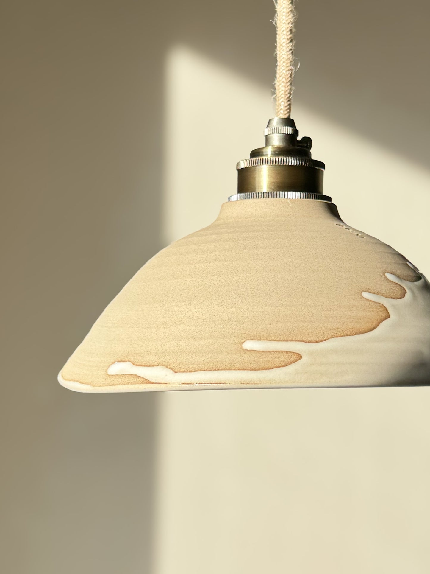 Ceramic Lamp Shade – Yuki #02, featuring a slanted raw clay design with creamy glaze drip and glossy white interior, perfect for soft lighting.