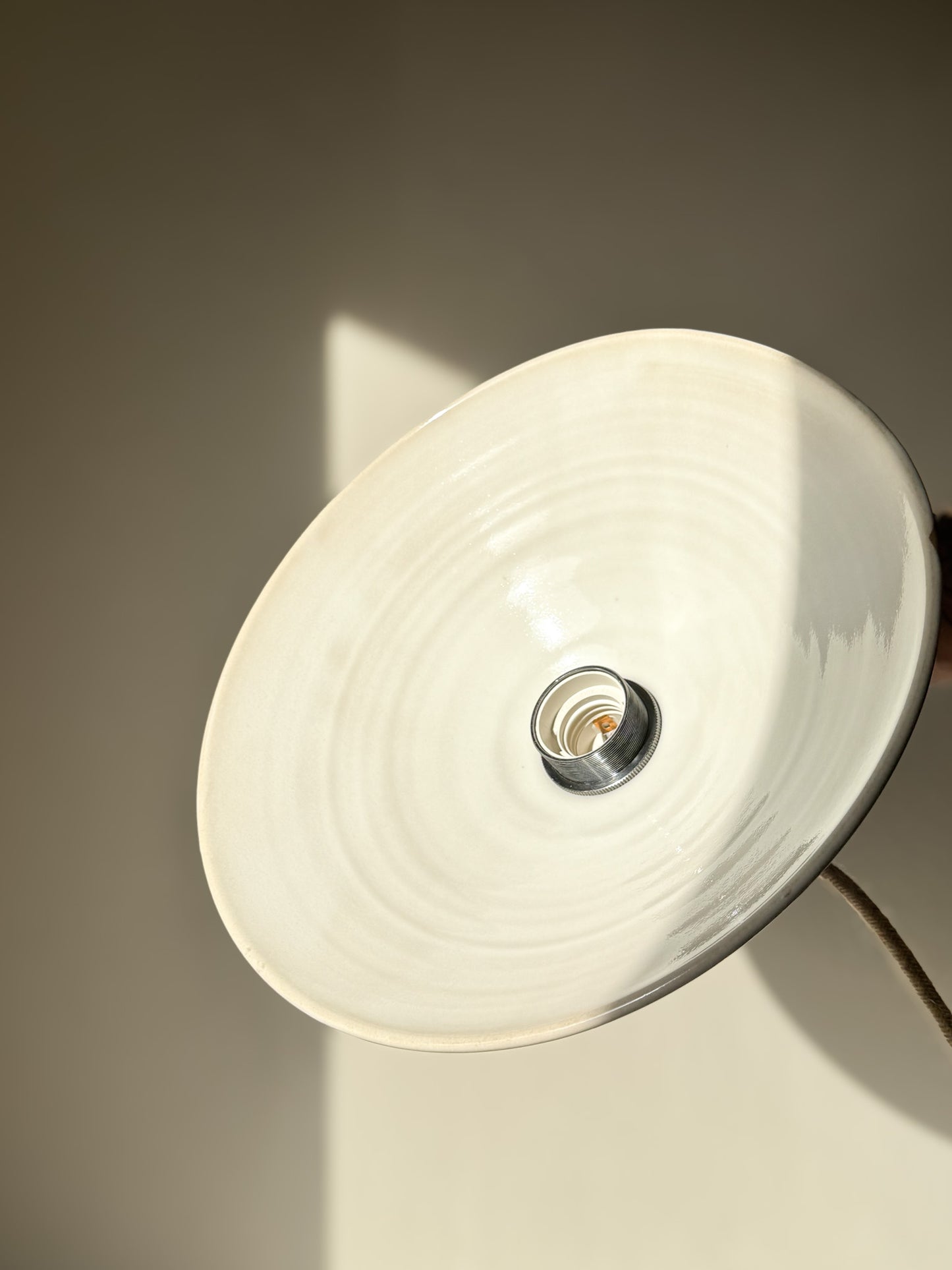 Ceramic Lamp Shade – Yuki #01 showing a glossy white glaze interior in soft light.