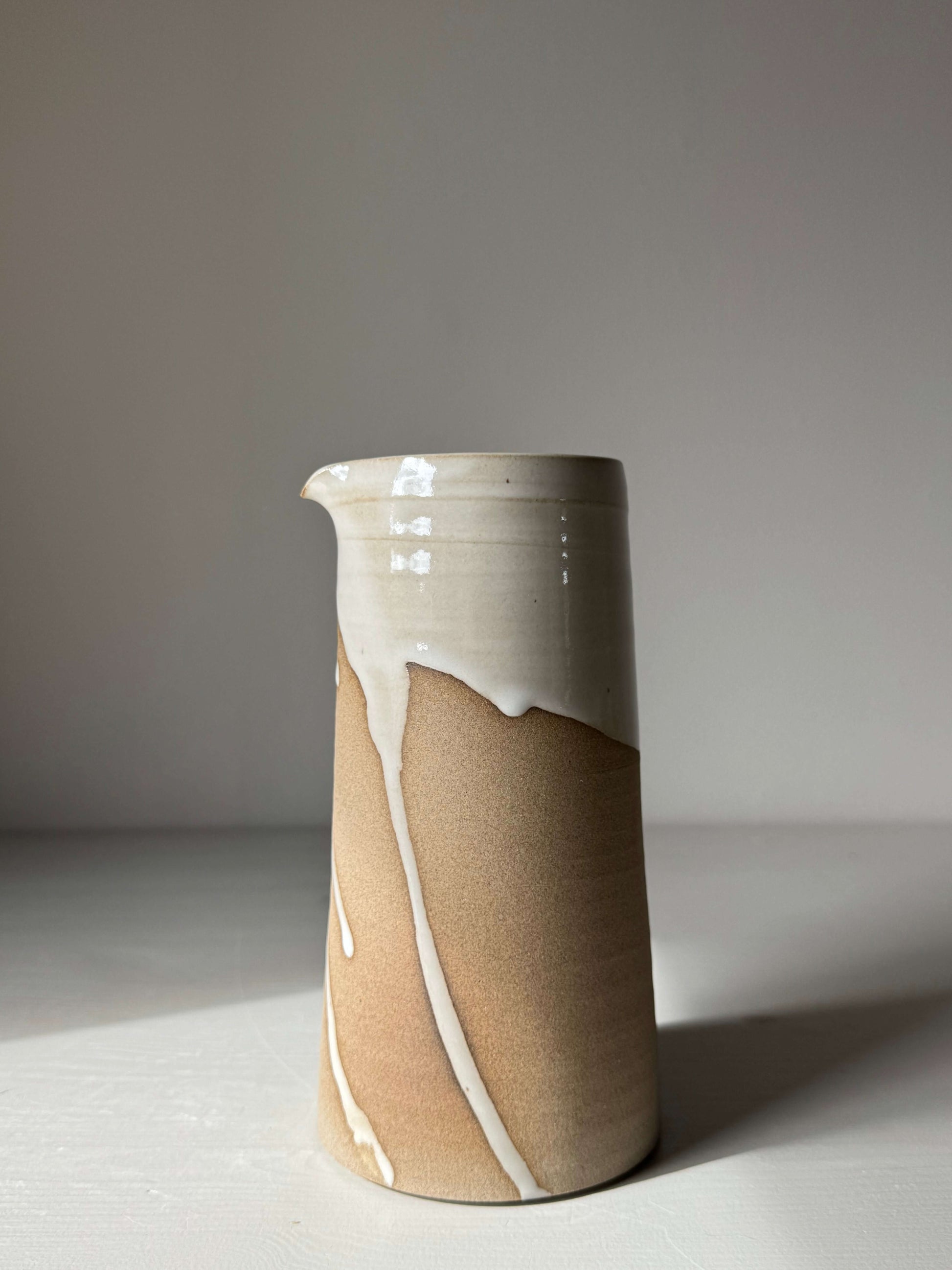 Handmade ceramic Large Vase / Jug – Yuki Series in glossy white and toffee clay with unglazed base, elegant indoor design.
