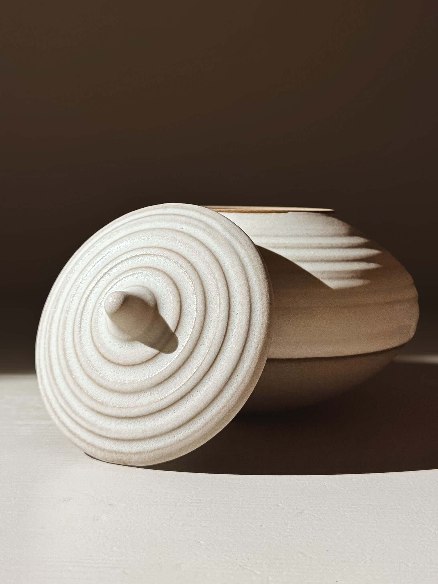 Lidded Jar - Eggshell #01, a handmade ceramic pottery piece, ideal for storing treasures with a neatly fitting lid.