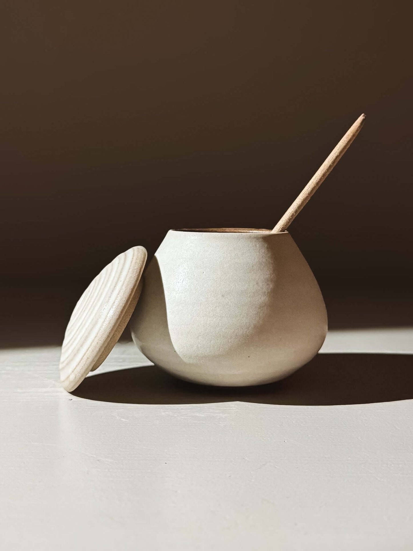 Lidded Jar - Eggshell #02 handmade ceramic pottery with lid opened, showcasing craft and elegance.