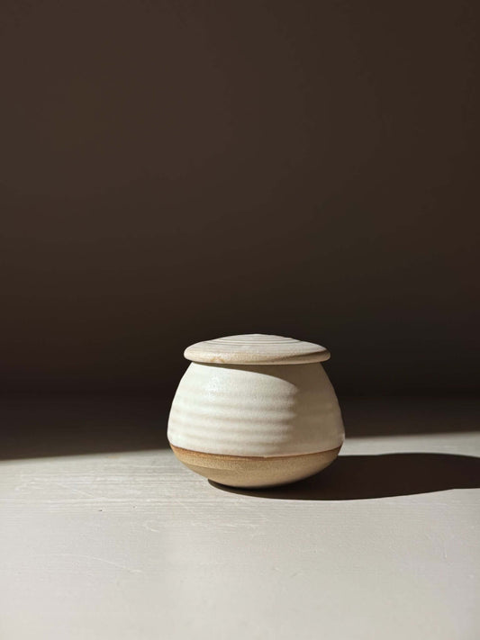 Handmade pottery Lidded Jar - Eggshell #03 in a minimalist design with a smooth, rounded form and a neatly fitting lid.