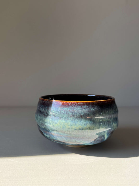 Handmade ceramic Matcha Bowl - Glossy Blue #03 with deep earthy tones and flowing blue hues, showcasing unique craftsmanship.