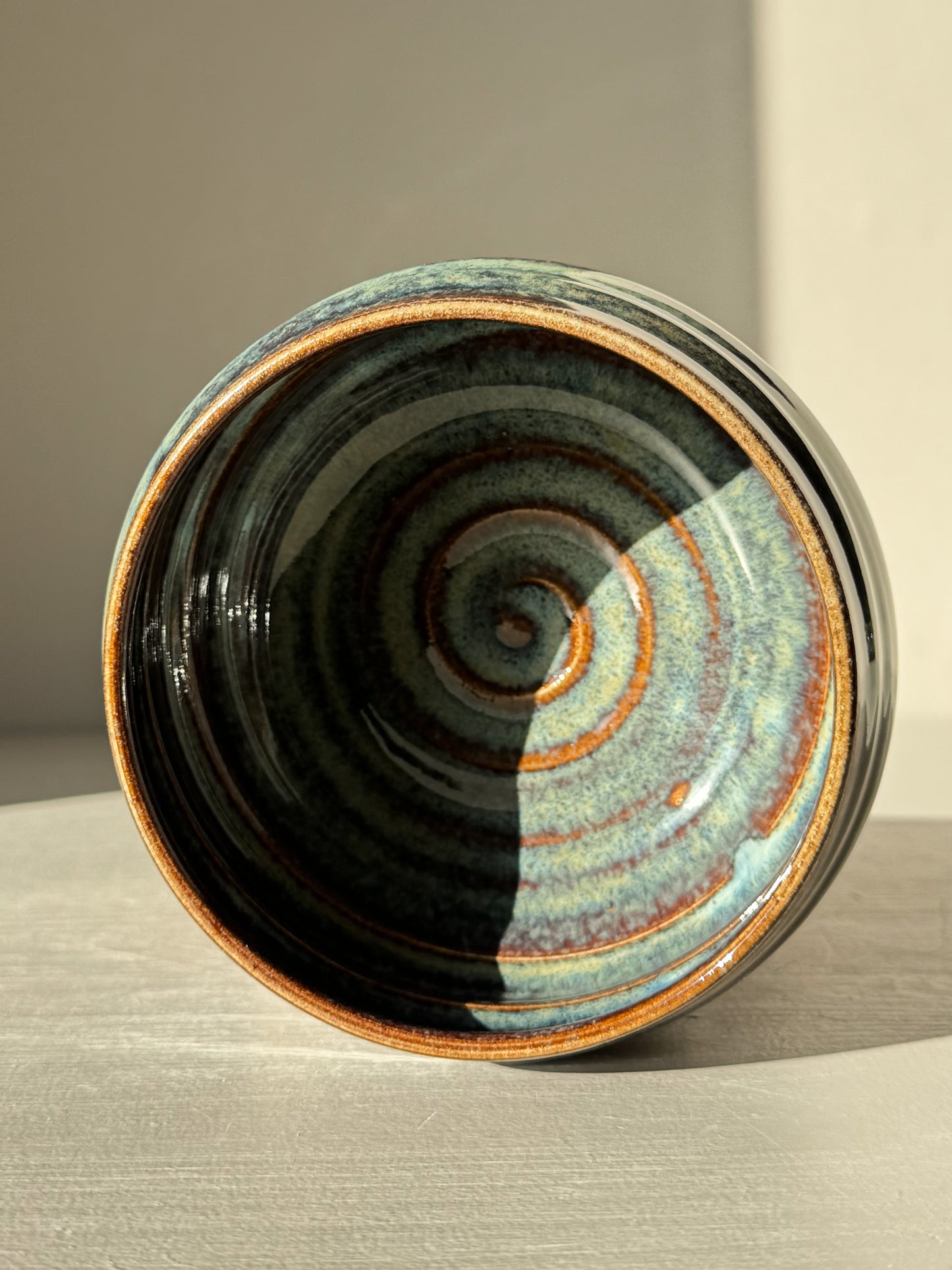 Matcha Bowl - Glossy Blue #03 with earthy tones and unique flowing blues inside, showcasing intricate, unpredictable design.